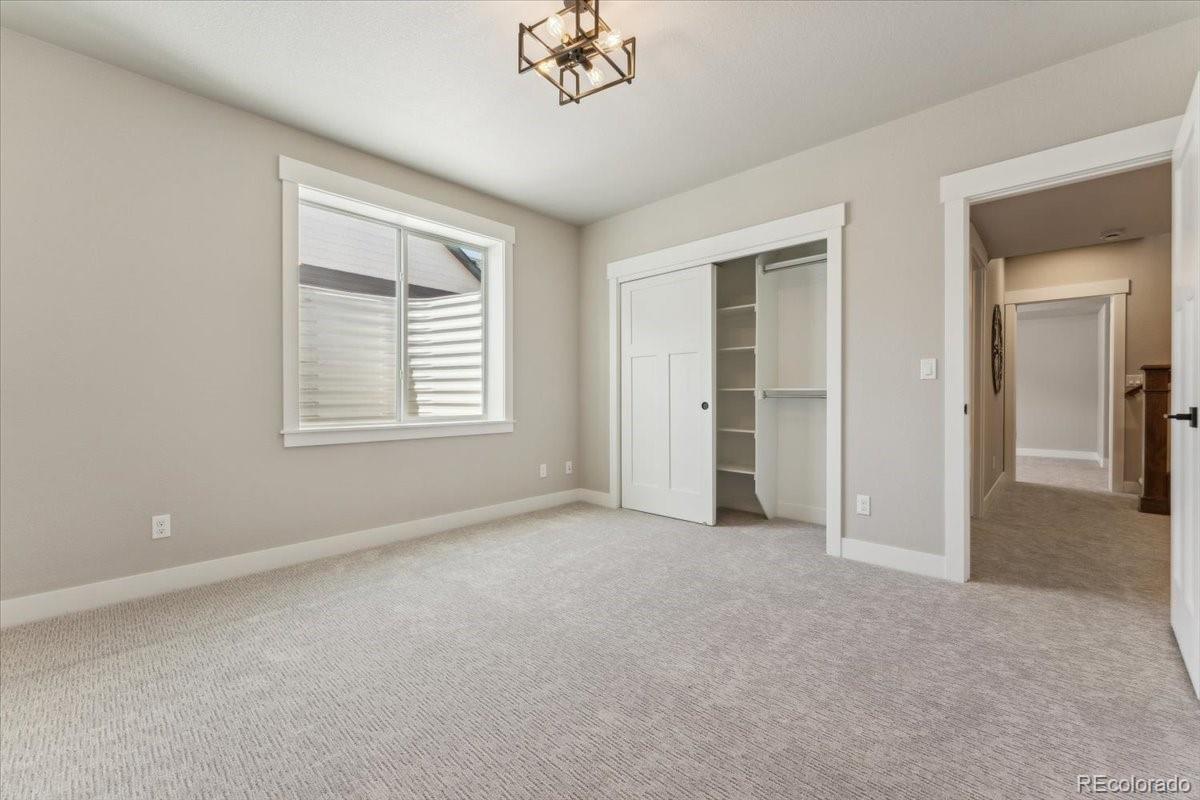 1361 Art Drive Berthoud, CO 80513 - Photo 33 of 40 a view of an empty room with a window