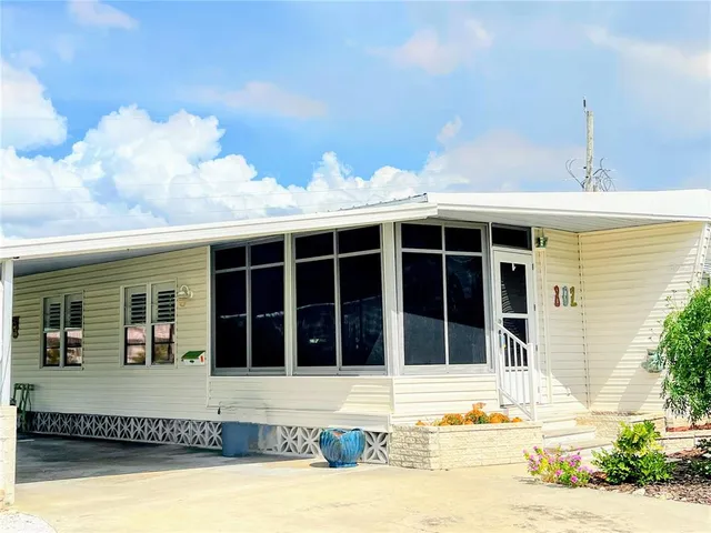 a front view of a house with a swimming pool