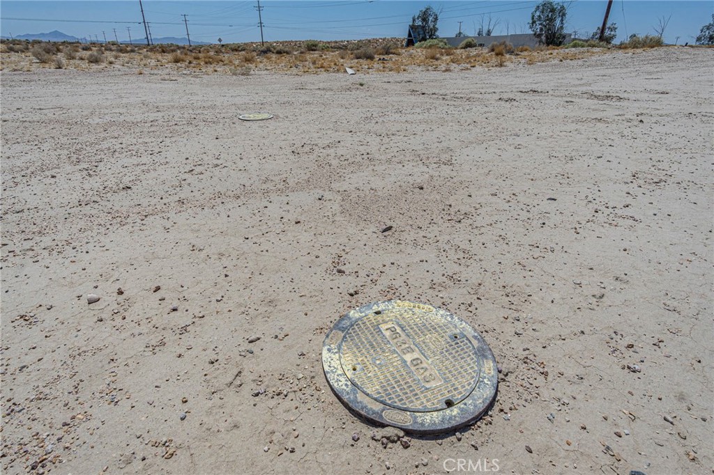 35453 Lenwood Road Barstow, CA 92311 - Photo 10 of 14 a view of a dry ground with wooden fence