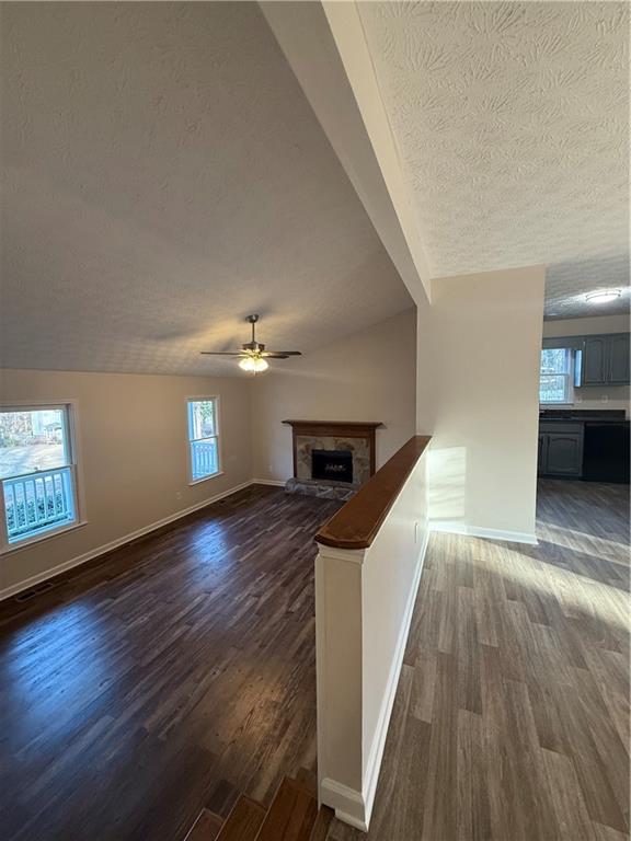 290 Mill Pointe Trail Dallas, GA 30157 - Photo 2 of 8 a view of a hallway with wooden floor and staircase