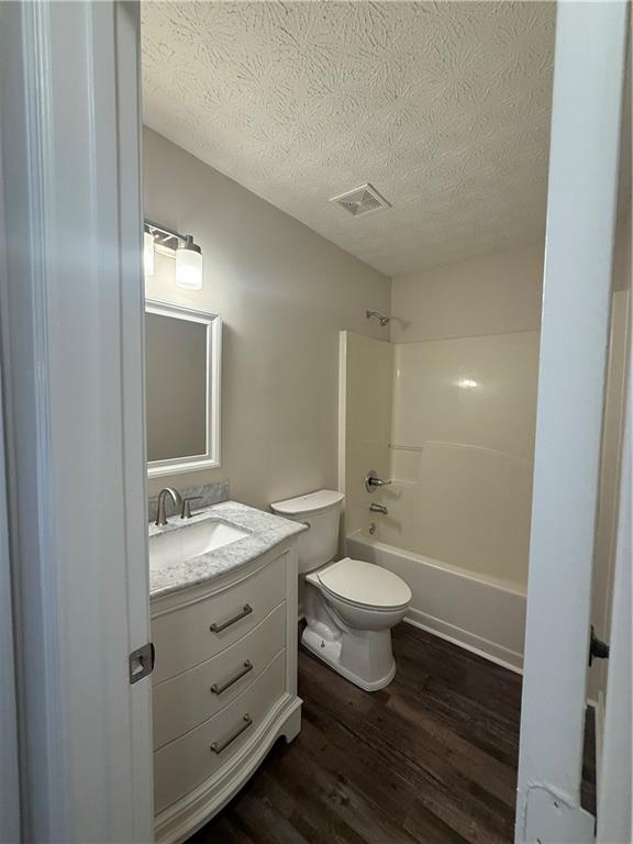 290 Mill Pointe Trail Dallas, GA 30157 - Photo 5 of 8 a bathroom with a double vanity sink toilet and mirror