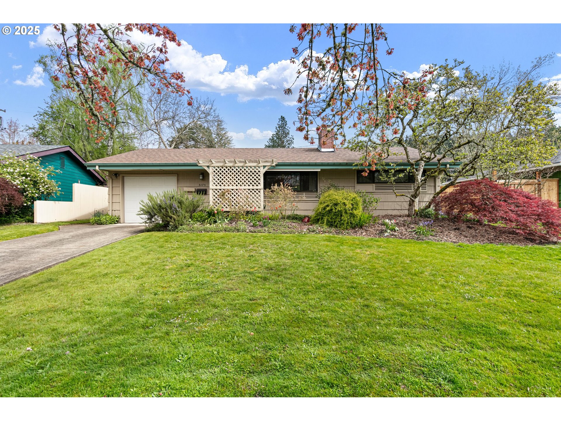 a front view of a house with garden