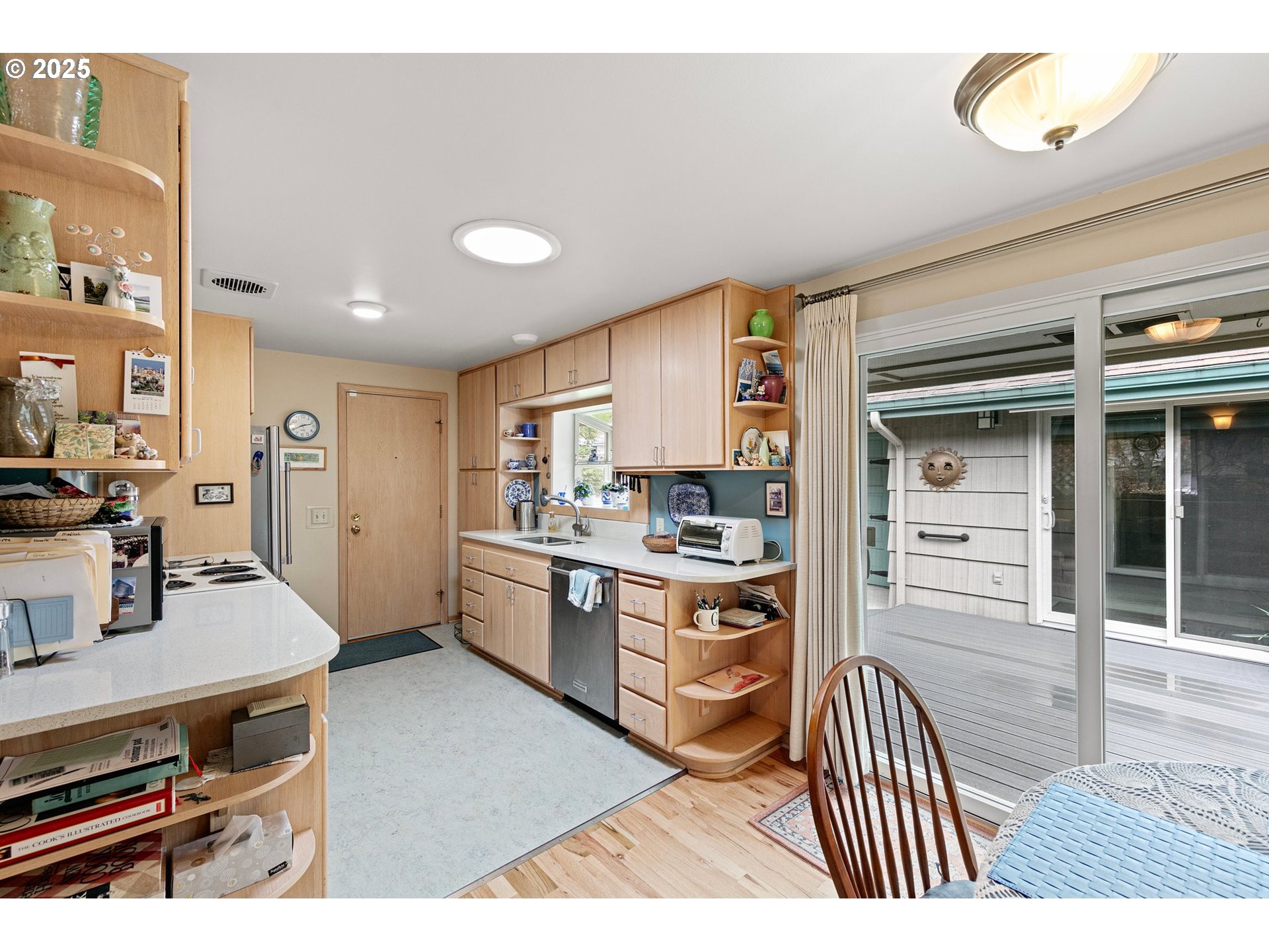 3175 Potter Street Eugene, OR 97405 - Photo 12 of 45 a kitchen with a refrigerator and a stove top oven
