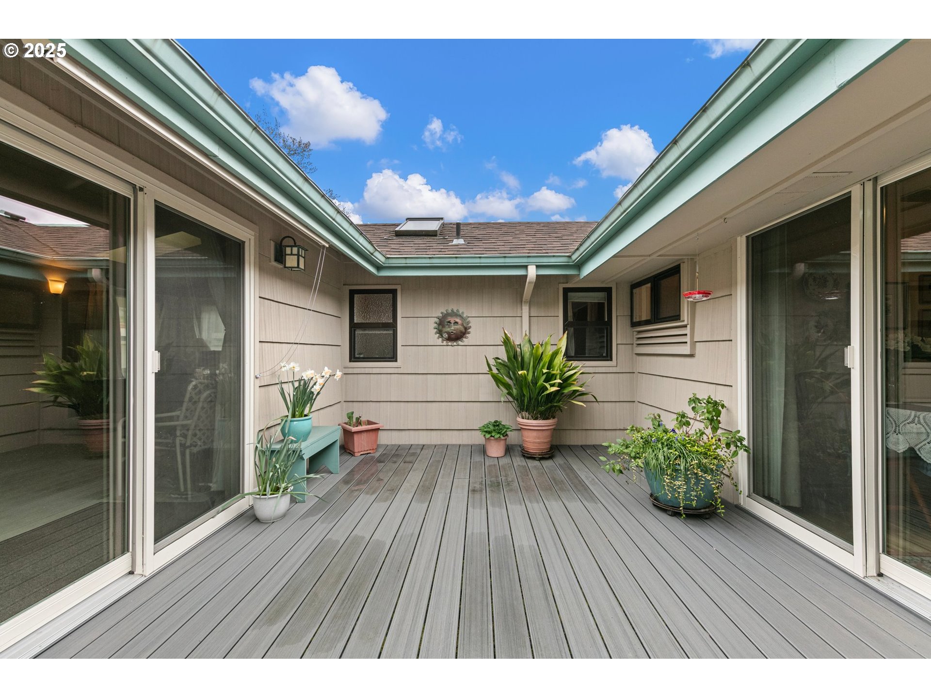 3175 Potter Street Eugene, OR 97405 - Photo 28 of 45 a hallway with potted plants and wooden floor
