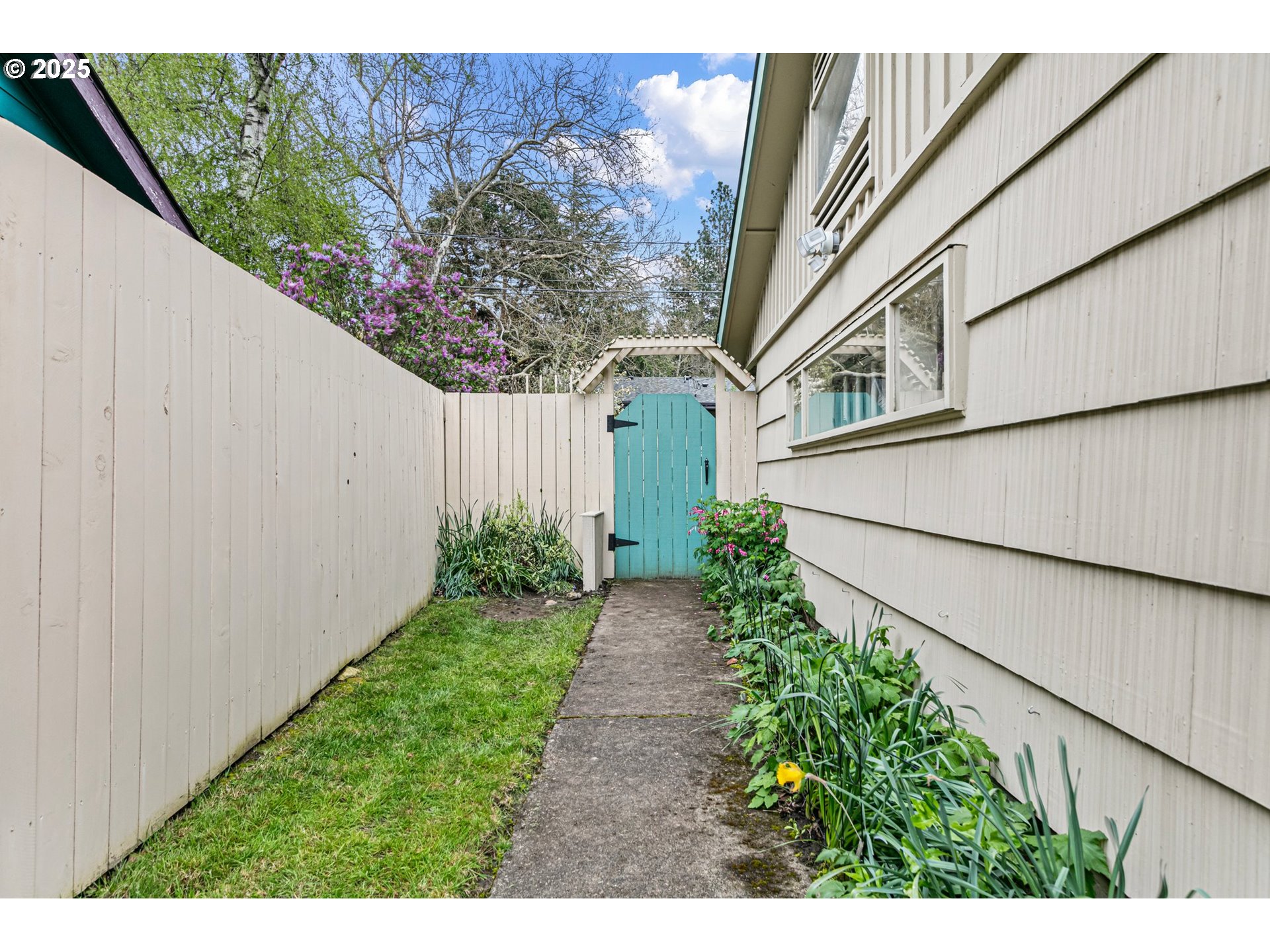 3175 Potter Street Eugene, OR 97405 - Photo 4 of 45 a view of a pathway of a house with wooden fence