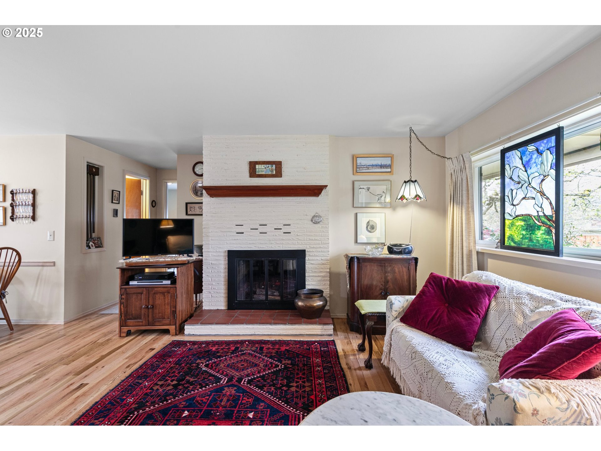 3175 Potter Street Eugene, OR 97405 - Photo 8 of 45 a living room with furniture and a fireplace