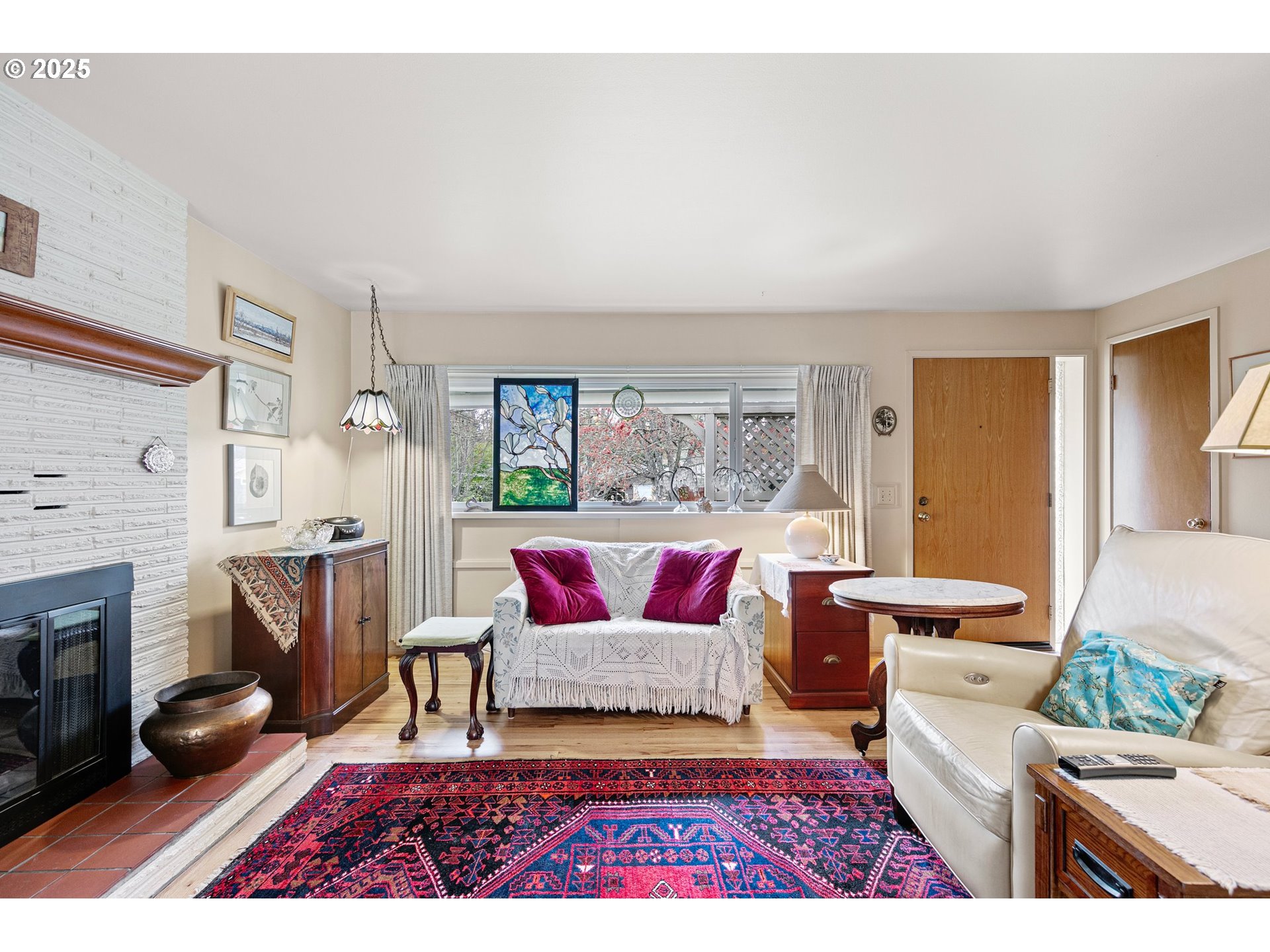 3175 Potter Street Eugene, OR 97405 - Photo 10 of 45 a living room with furniture and a fireplace