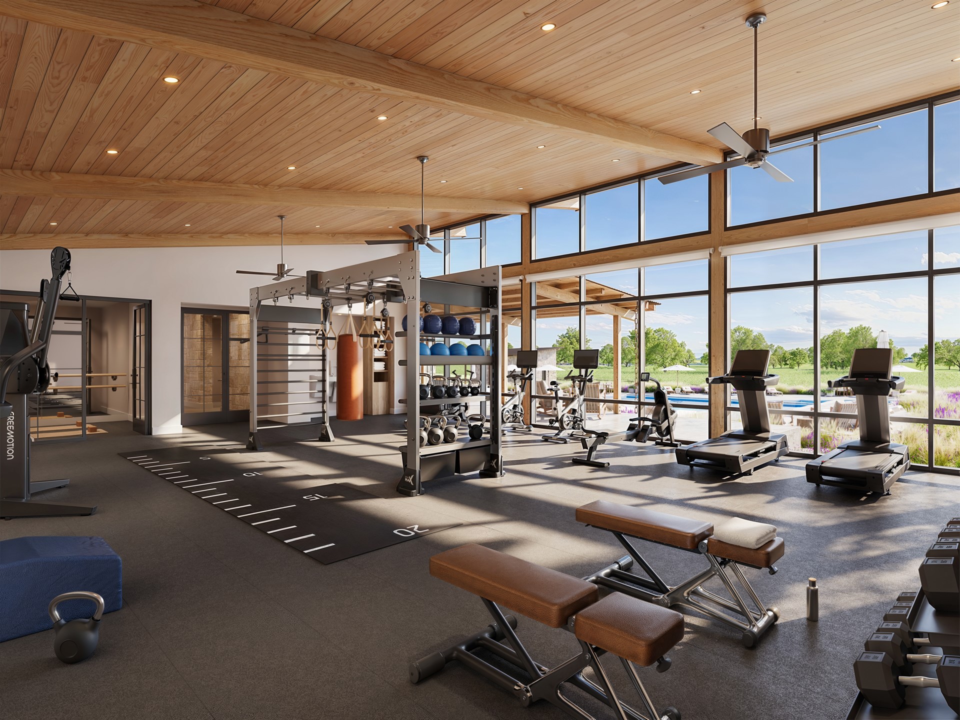 310 Hye Springs Road, Unit 107 Hye, TX 78635 - Photo 12 of 20 State-of-the-art fitness center featuring modern equipment, natural light, and scenic views overlooking the resort-style pool and grounds.