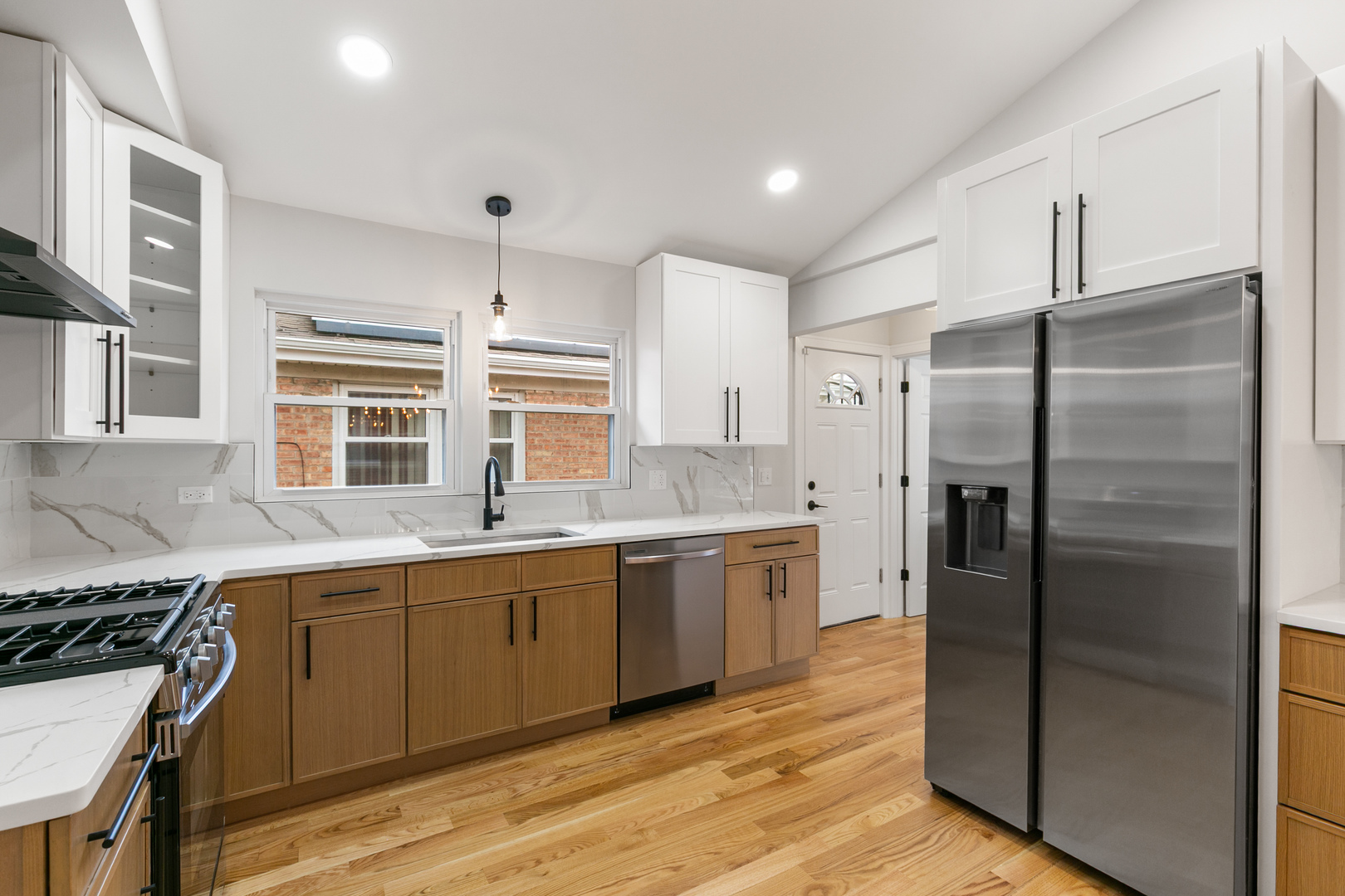 1042 West 109th Place Chicago, IL 60643 - Photo 12 of 24 a kitchen with stainless steel appliances granite countertop a refrigerator and a sink