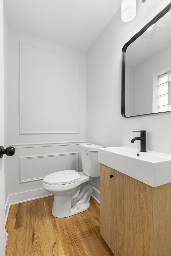 1042 West 109th Place Chicago, IL 60643 - Photo 13 of 24 a bathroom with a sink toilet and mirror