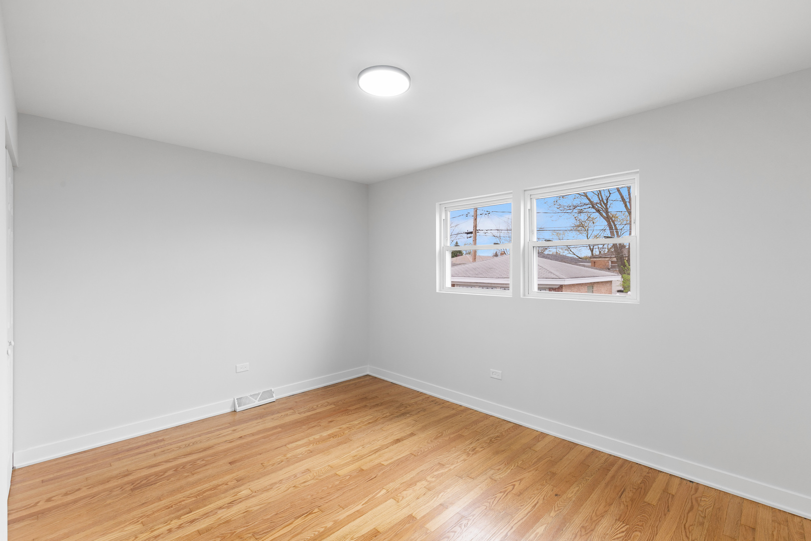 1042 West 109th Place Chicago, IL 60643 - Photo 16 of 24 a view of empty room with wooden floor
