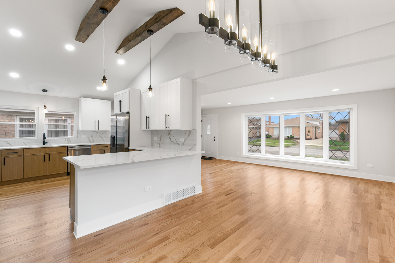 1042 West 109th Place Chicago, IL 60643 - Photo 6 of 24 a large kitchen with kitchen island a large island in it