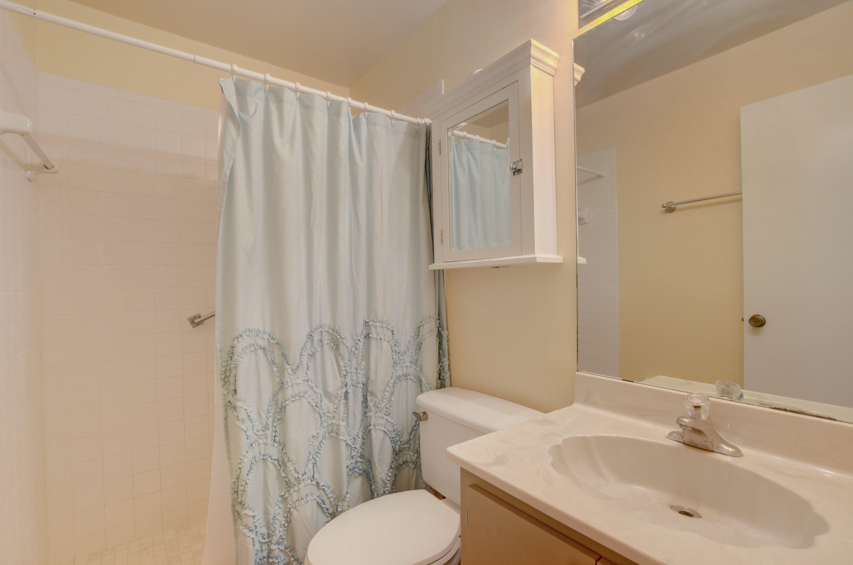 569 Southwest 28th Avenue Delray Beach, FL 33445 - Photo 16 of 25 a bathroom with a sink toilet and shower
