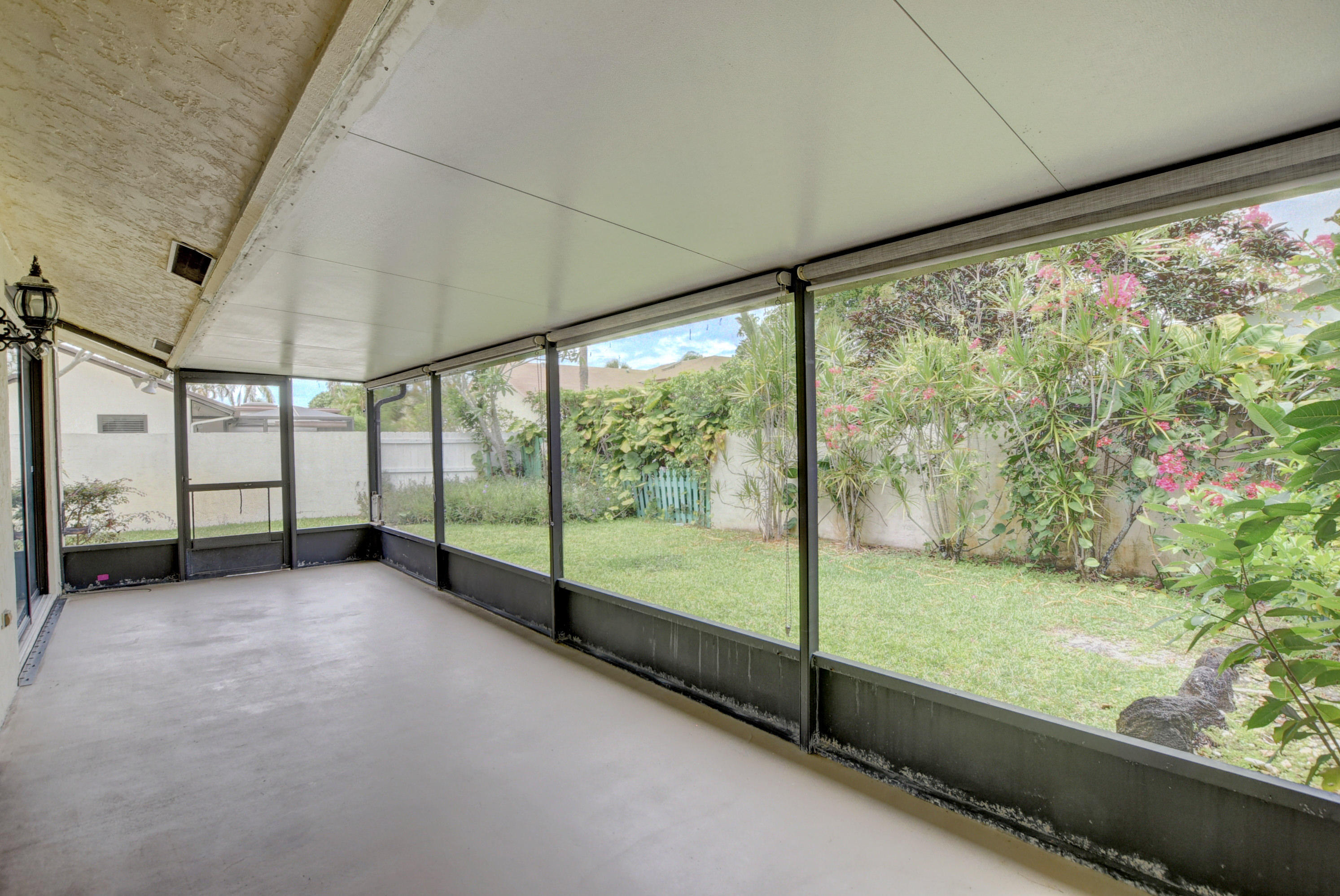 569 Southwest 28th Avenue Delray Beach, FL 33445 - Photo 17 of 25 a view of an empty room with a large window