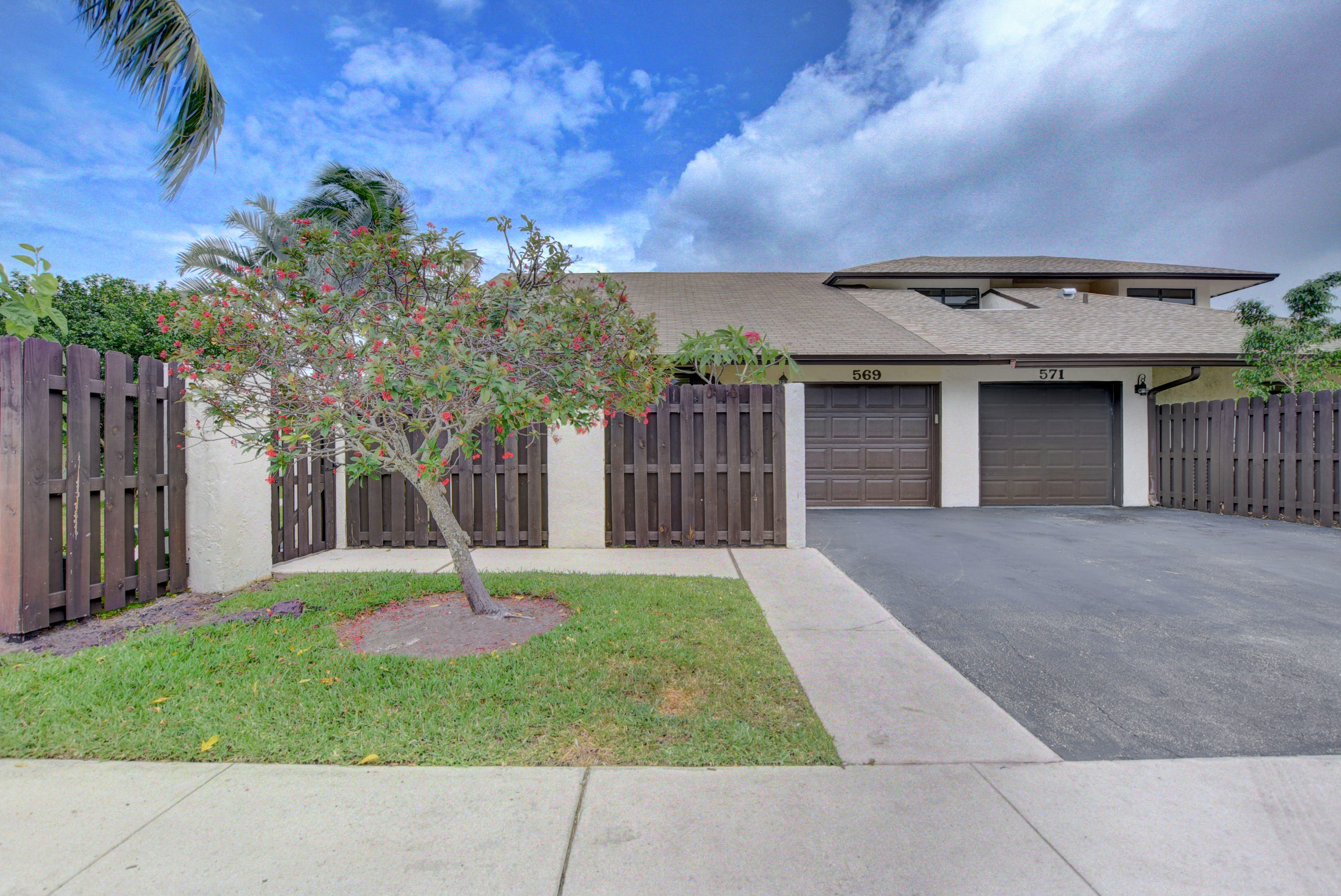 569 Southwest 28th Avenue Delray Beach, FL 33445 - Photo 22 of 25 a house with garden in front of it
