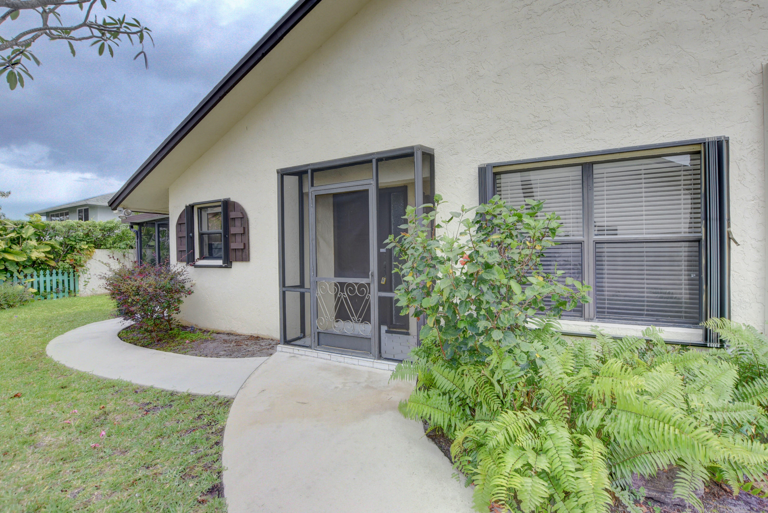 569 Southwest 28th Avenue Delray Beach, FL 33445 - Photo 25 of 25 front view of a house with a yard