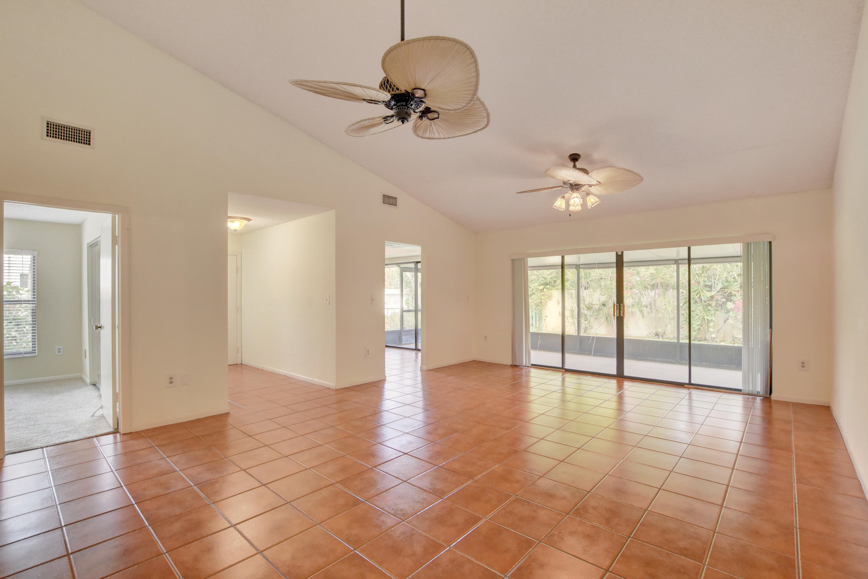 569 Southwest 28th Avenue Delray Beach, FL 33445 - Photo 3 of 25 a view of an empty room with a window
