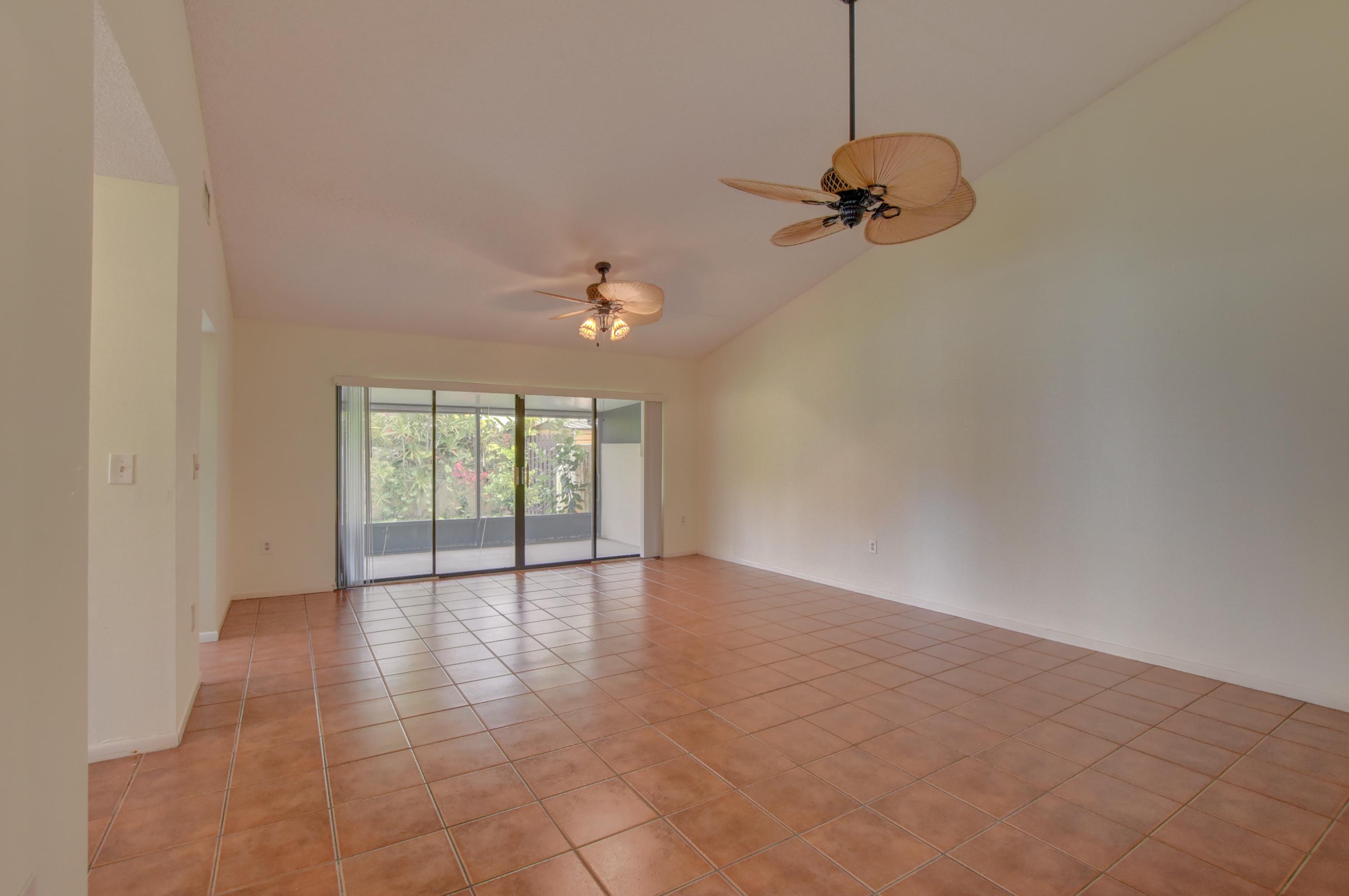 569 Southwest 28th Avenue Delray Beach, FL 33445 - Photo 4 of 25 a view of an empty room with a window