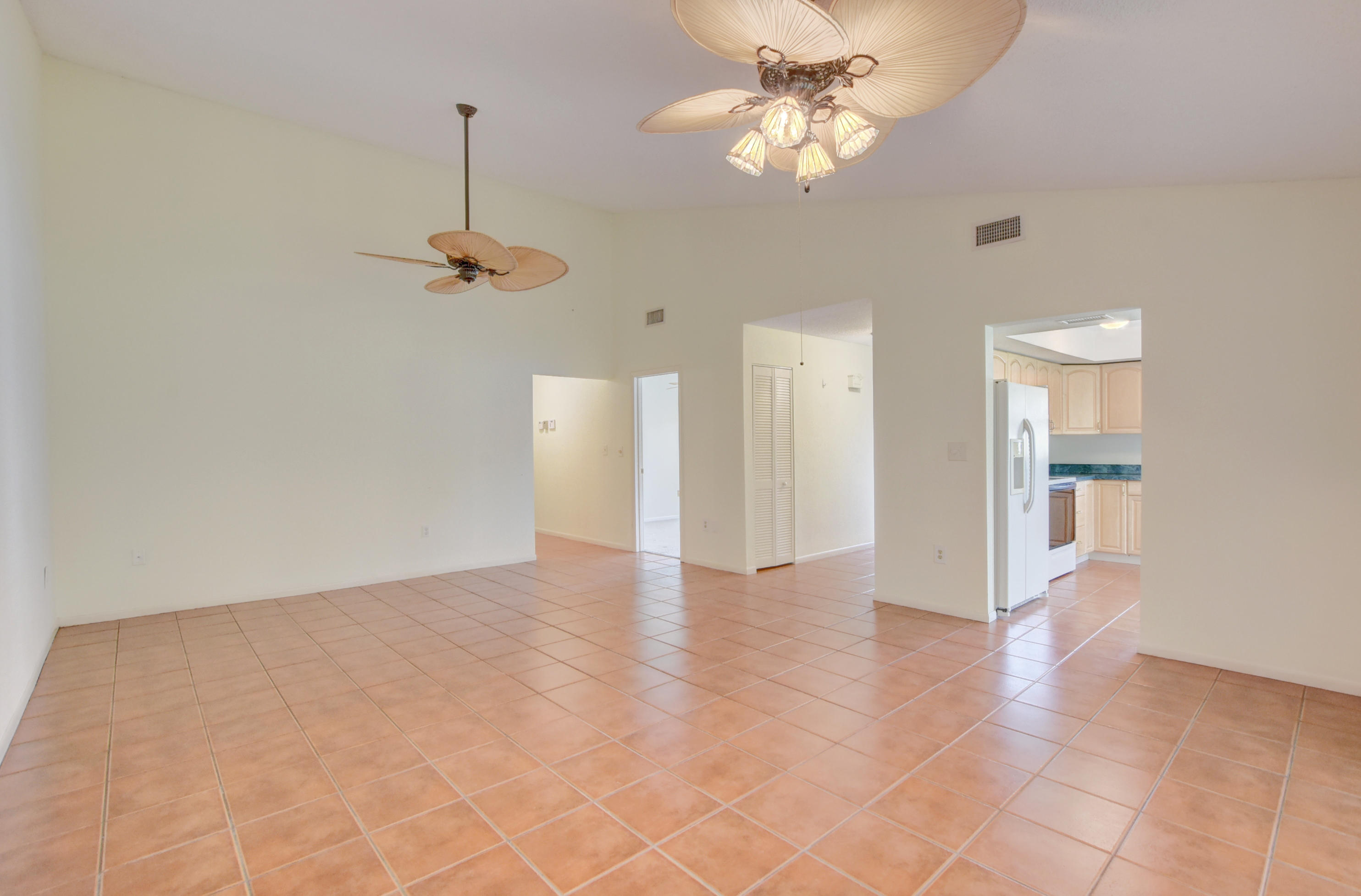 569 Southwest 28th Avenue Delray Beach, FL 33445 - Photo 5 of 25 a view of an empty room with a chandelier fan