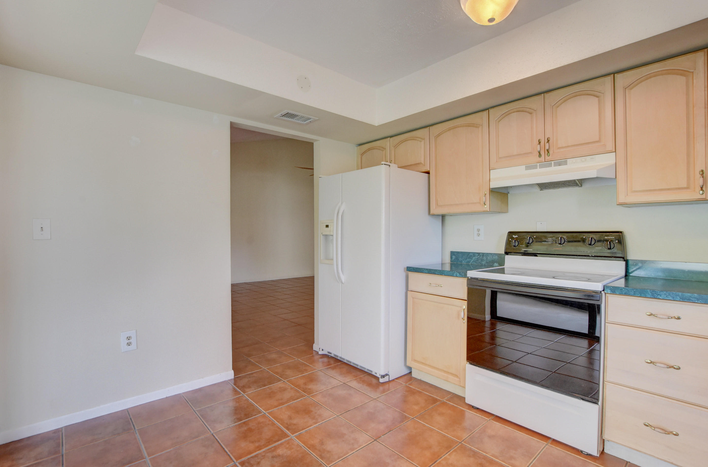 569 Southwest 28th Avenue Delray Beach, FL 33445 - Photo 7 of 25 a kitchen with cabinets and appliances