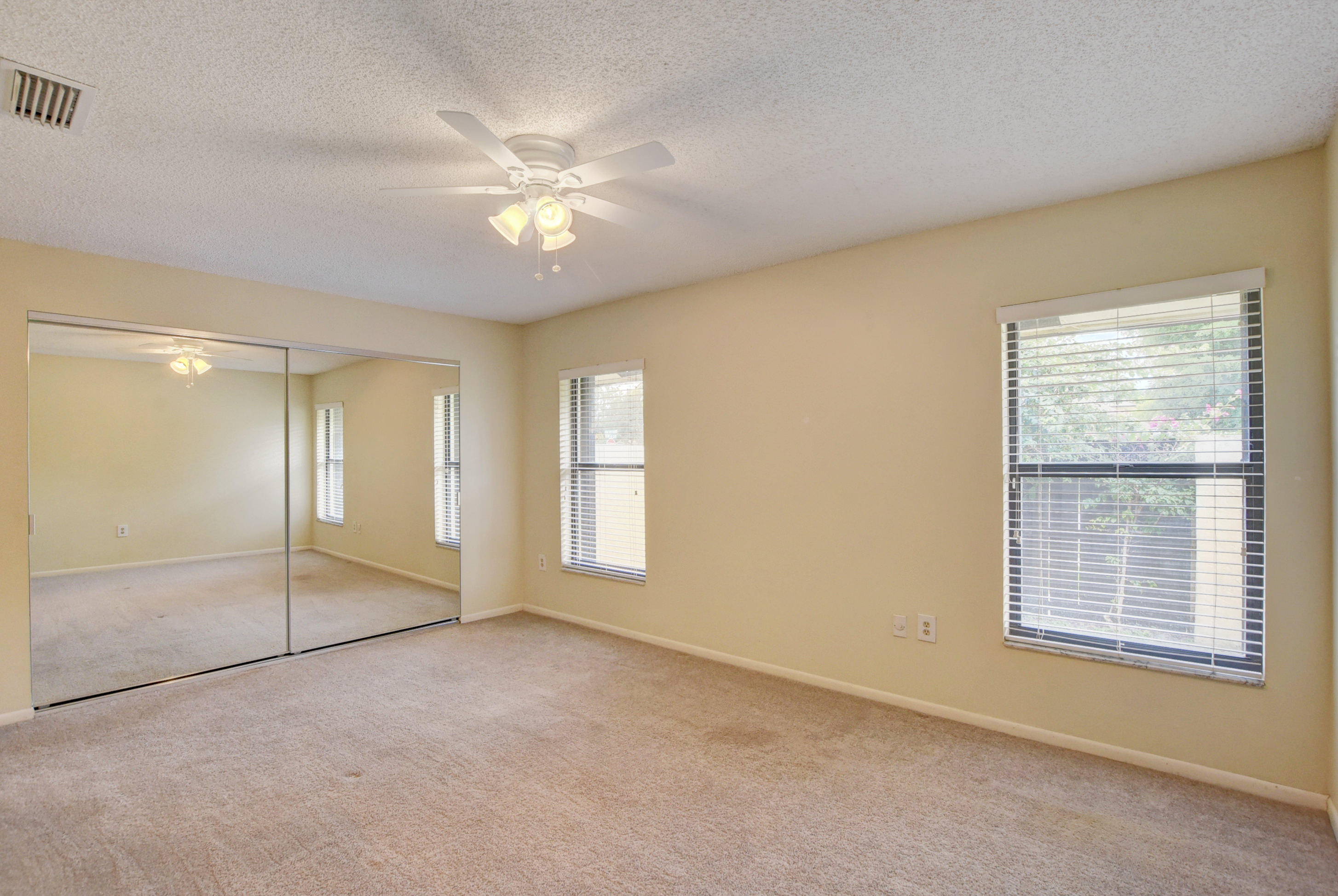 569 Southwest 28th Avenue Delray Beach, FL 33445 - Photo 9 of 25 a view of an empty room with chandelier fan and fire place