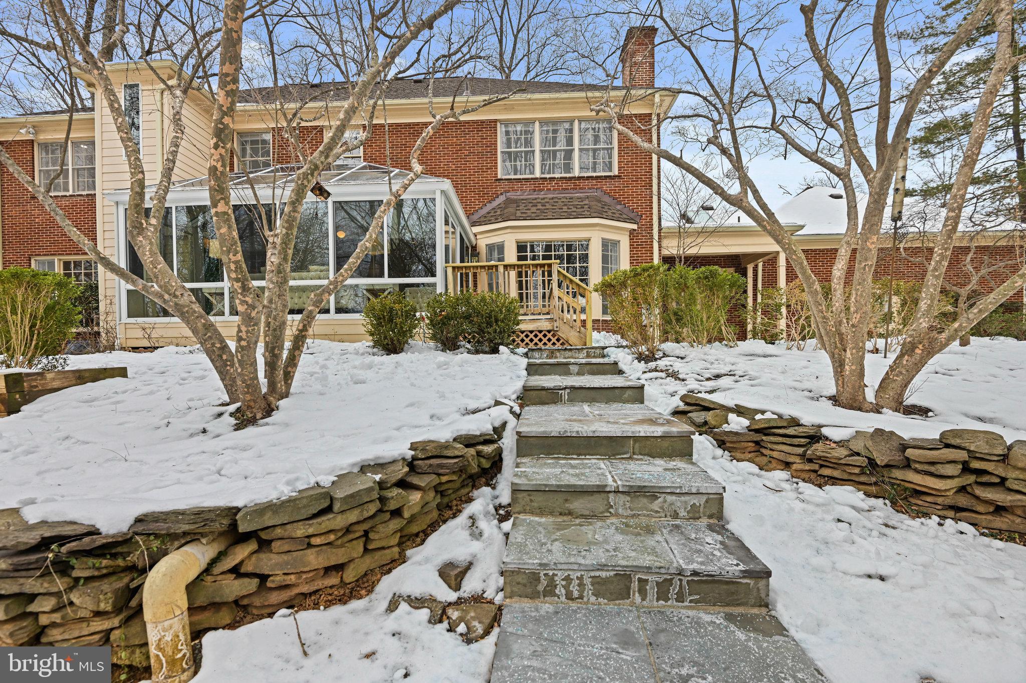 735 Potomac River Road McLean, VA 22102 - Photo 18 of 126 a front view of a building with large trees