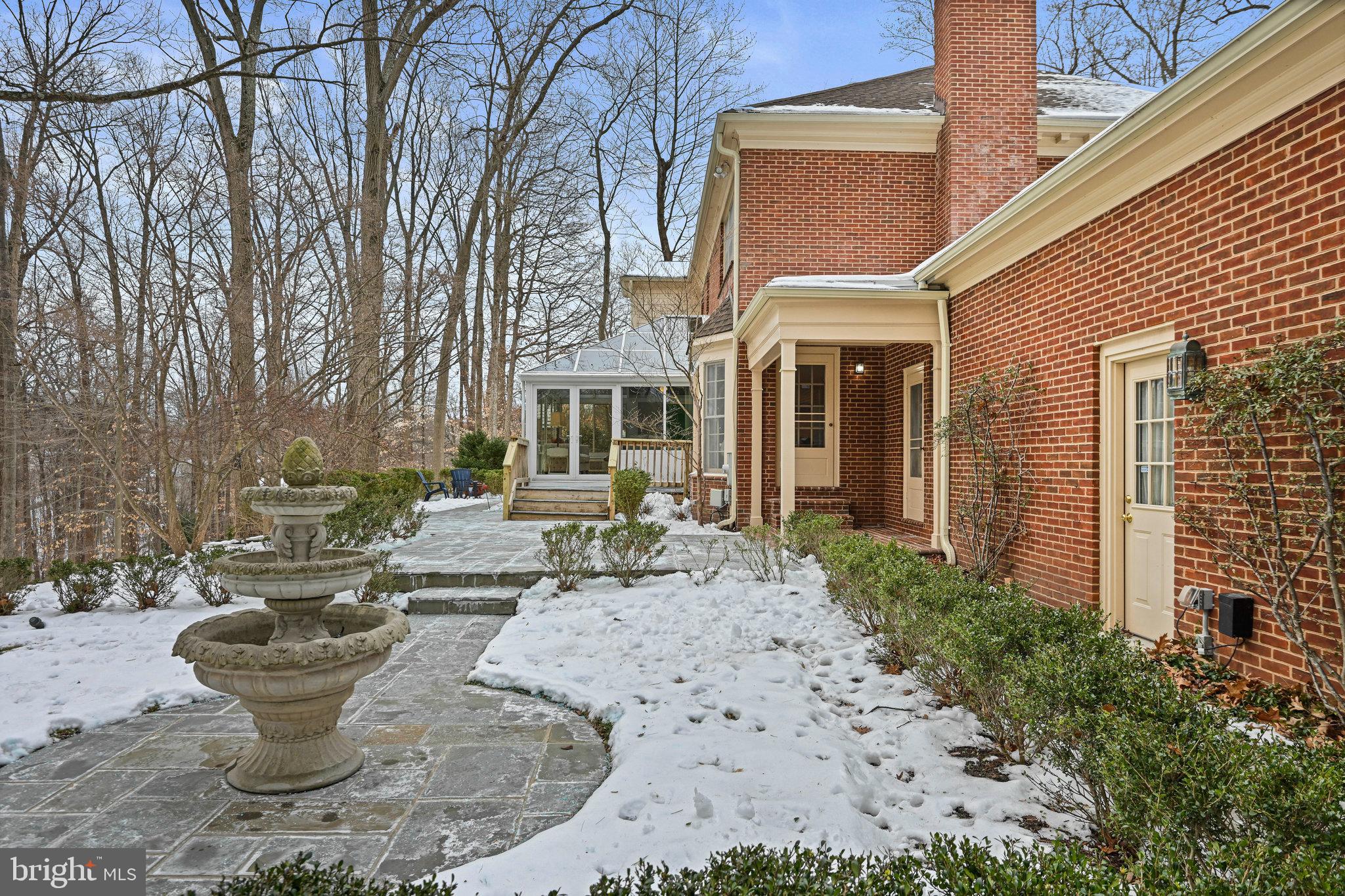 735 Potomac River Road McLean, VA 22102 - Photo 22 of 126 a view of a house with backyard water fountain and sitting area