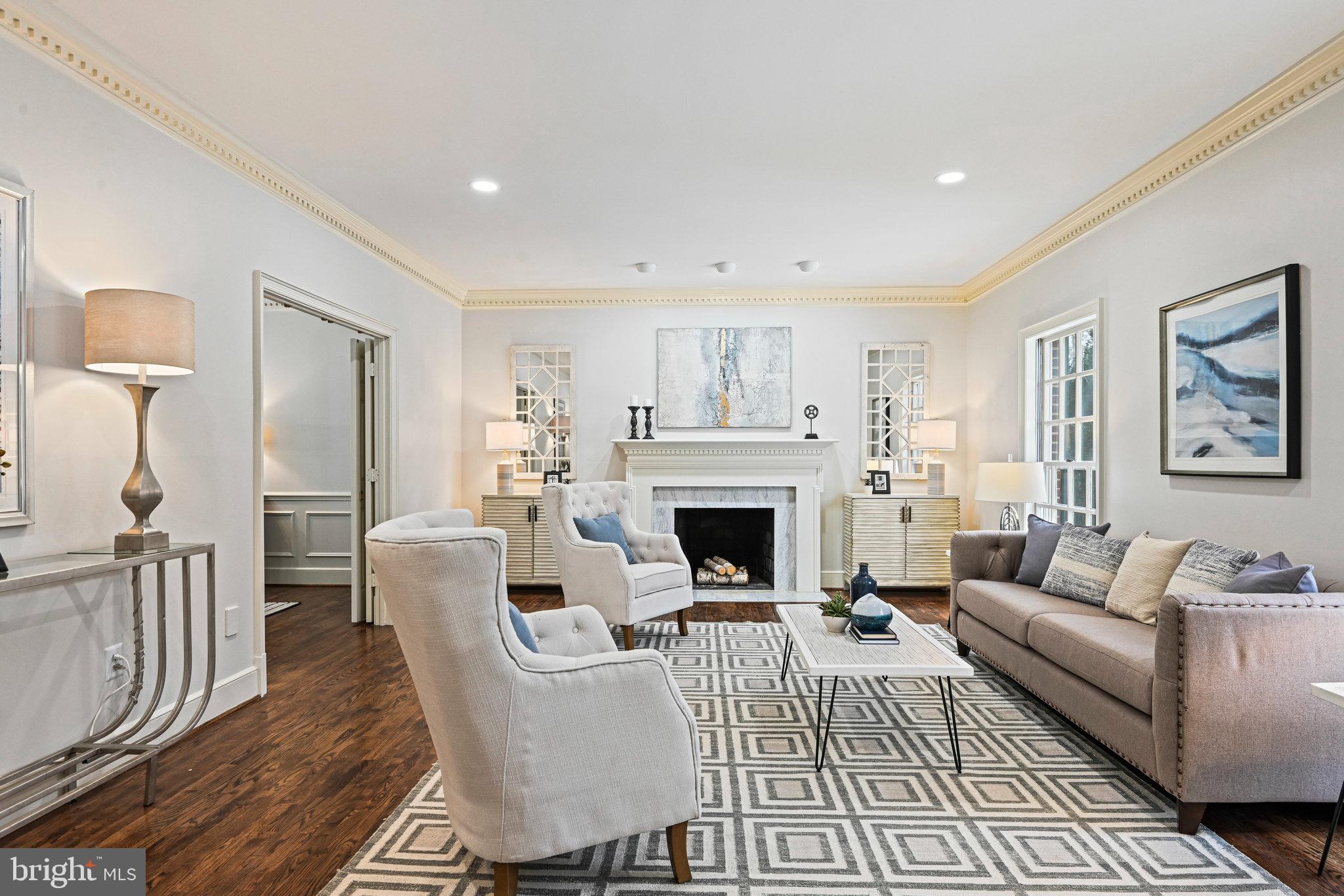 735 Potomac River Road McLean, VA 22102 - Photo 3 of 126 a living room with furniture a rug a fireplace and a window