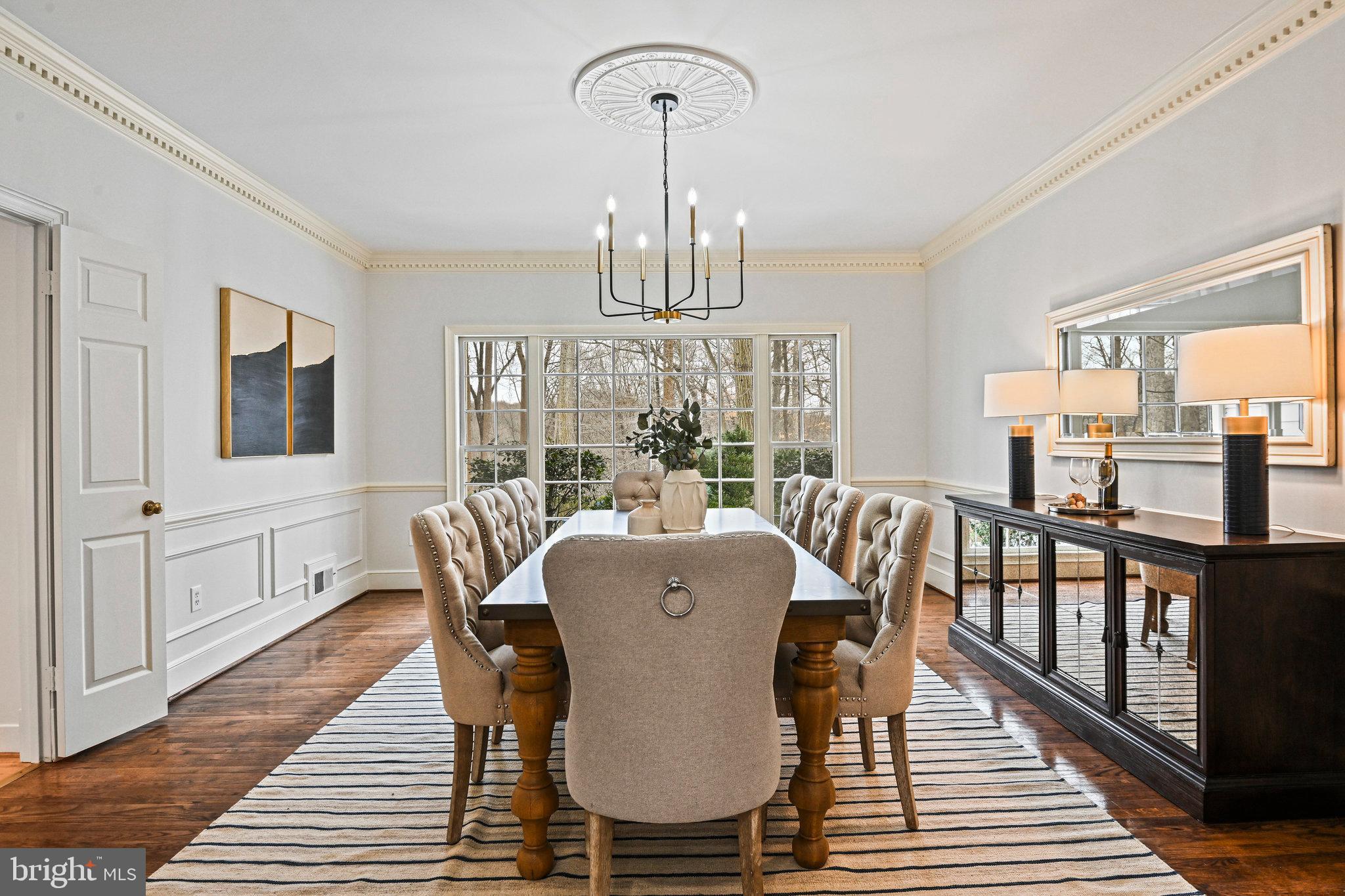 735 Potomac River Road McLean, VA 22102 - Photo 5 of 126 a dining room with furniture a chandelier and wooden floor
