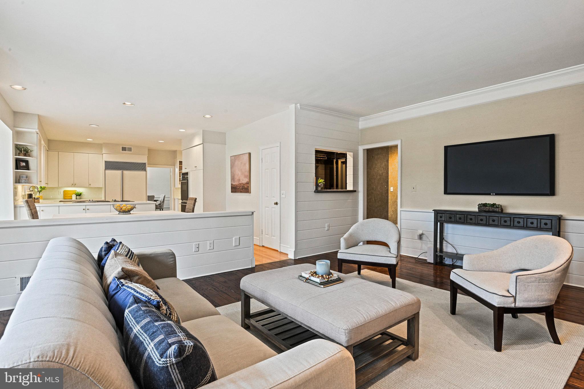735 Potomac River Road McLean, VA 22102 - Photo 55 of 126 a living room with furniture and a flat screen tv