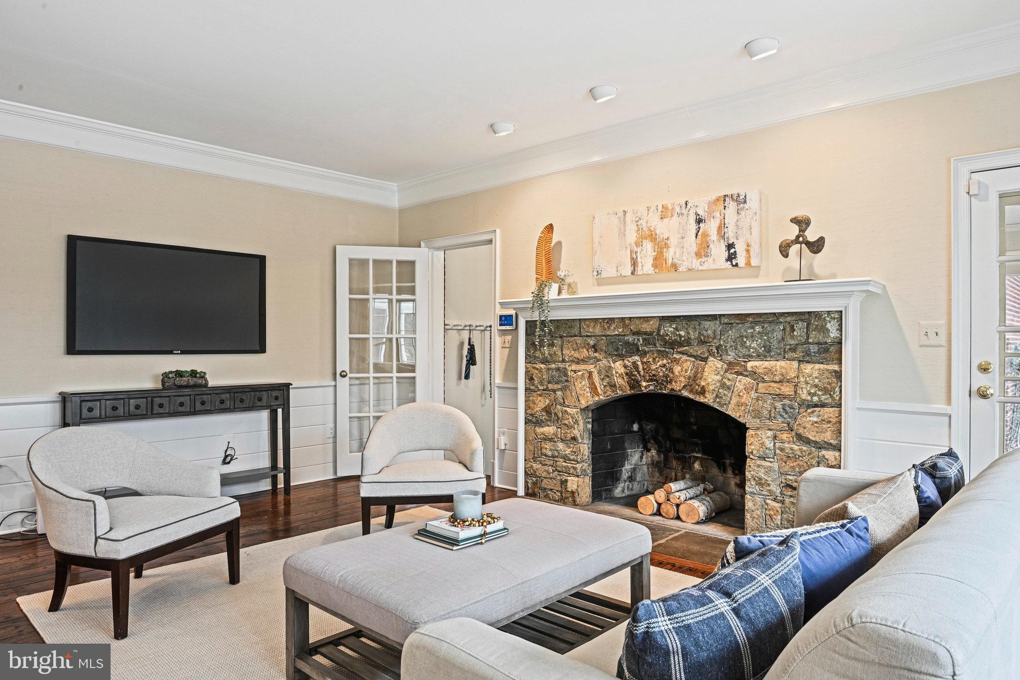735 Potomac River Road McLean, VA 22102 - Photo 56 of 126 a living room with furniture a flat screen tv and a fireplace