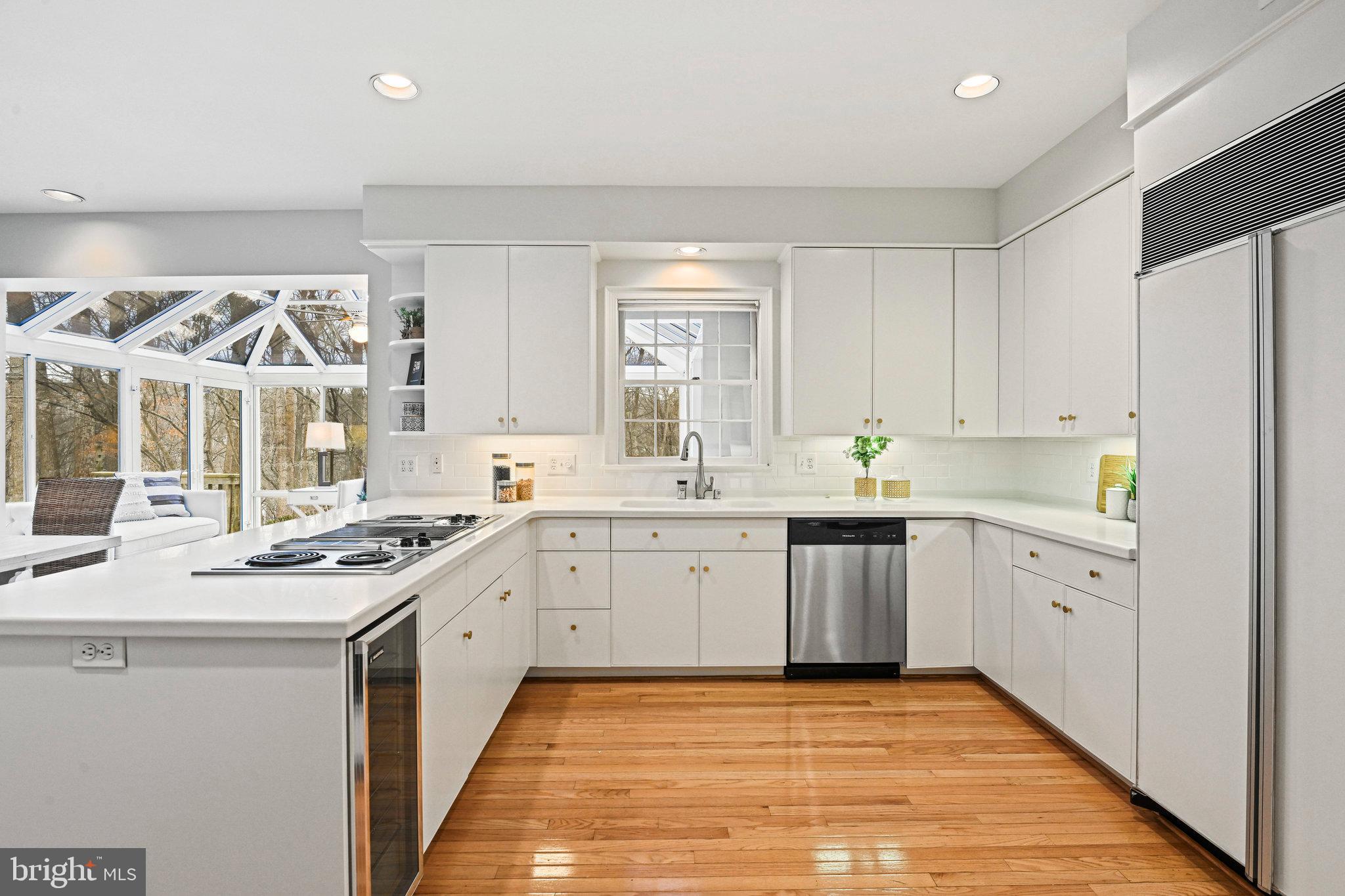 735 Potomac River Road McLean, VA 22102 - Photo 6 of 126 a kitchen with a sink stove and cabinets