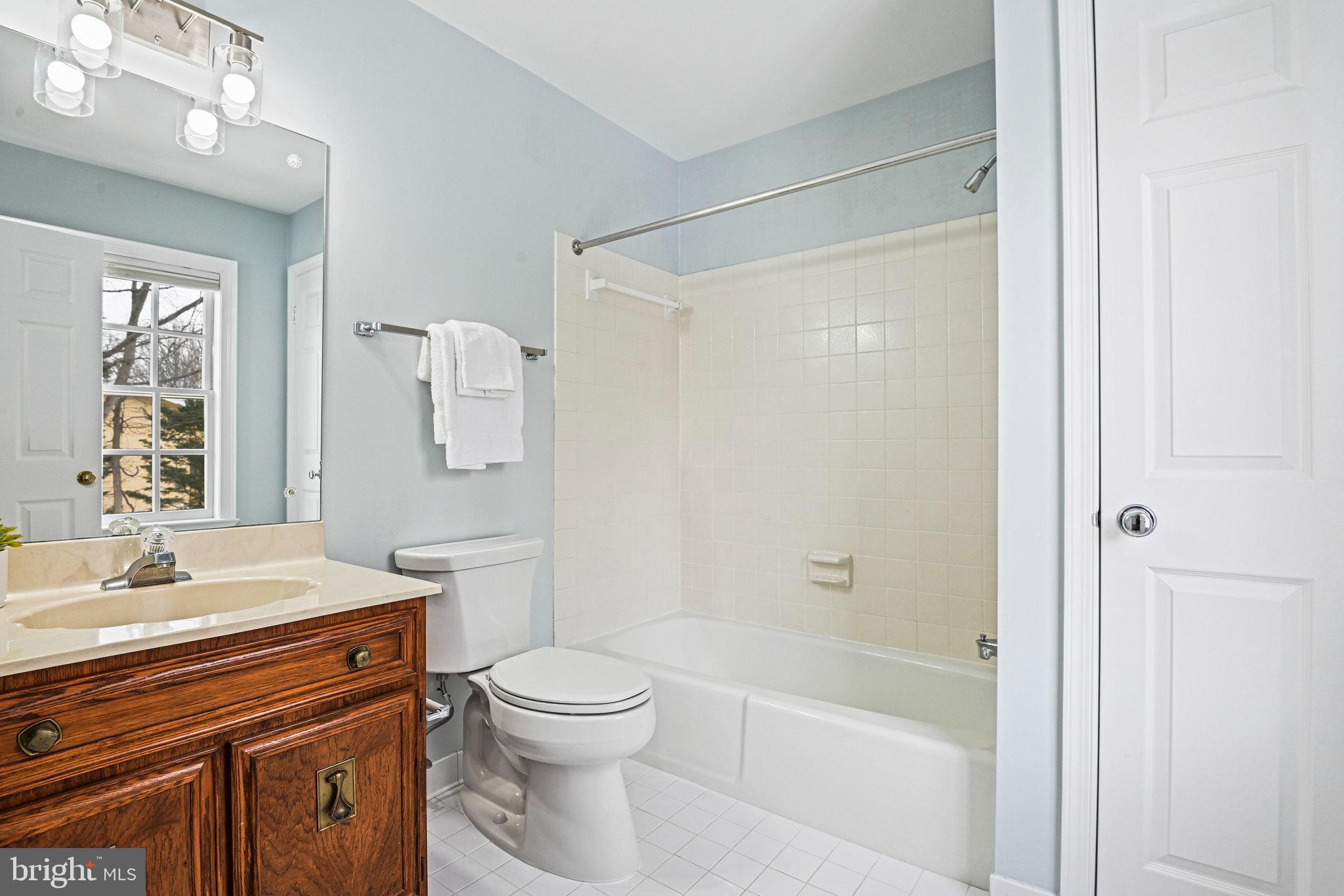 735 Potomac River Road McLean, VA 22102 - Photo 70 of 126 a bathroom with a sink a toilet and shower