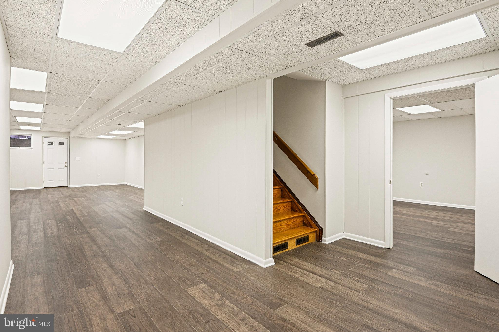 735 Potomac River Road McLean, VA 22102 - Photo 78 of 126 a view of an empty room with wooden floor and stairs