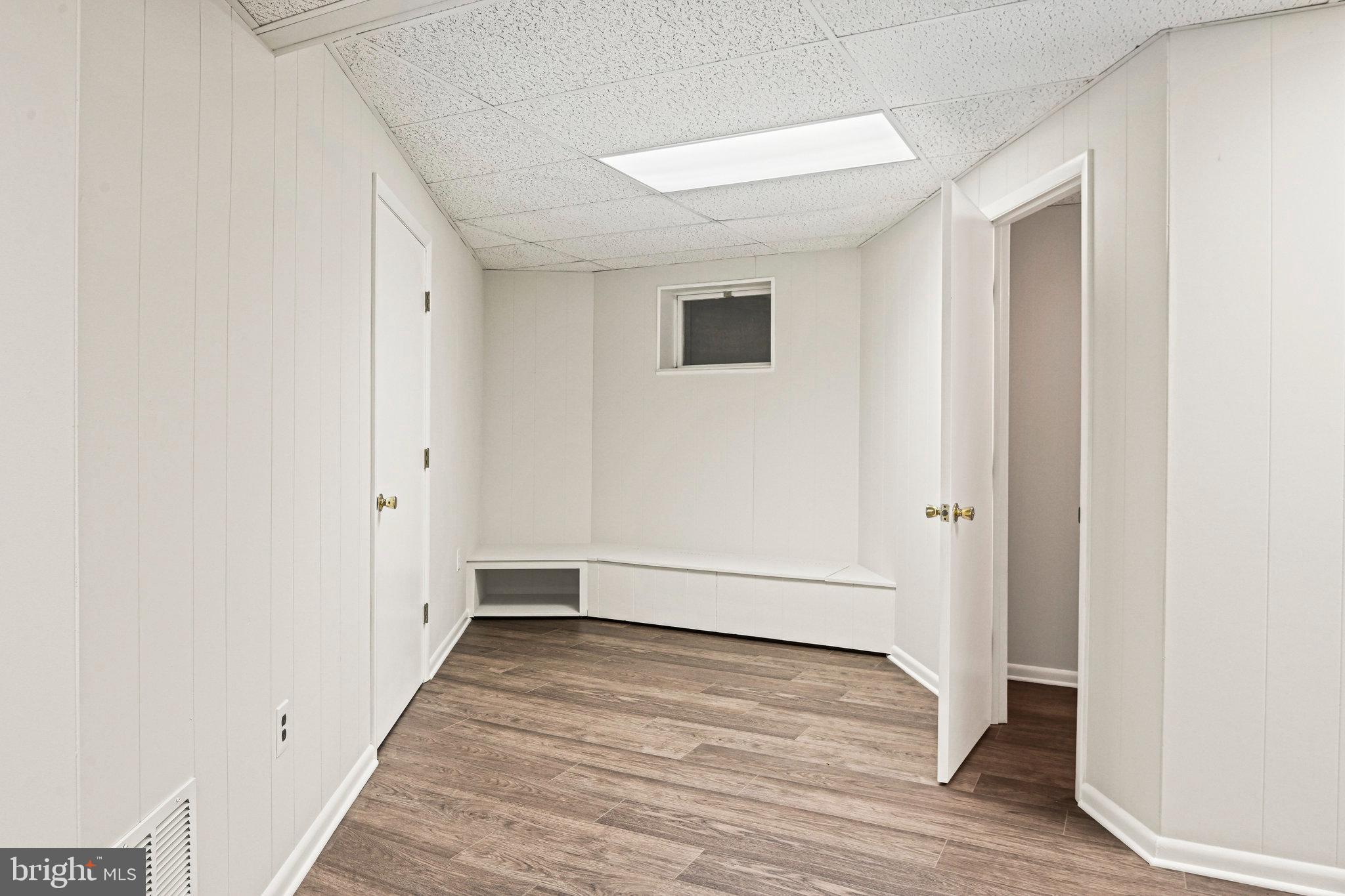 735 Potomac River Road McLean, VA 22102 - Photo 90 of 126 a view of an empty room with wooden floor and a window