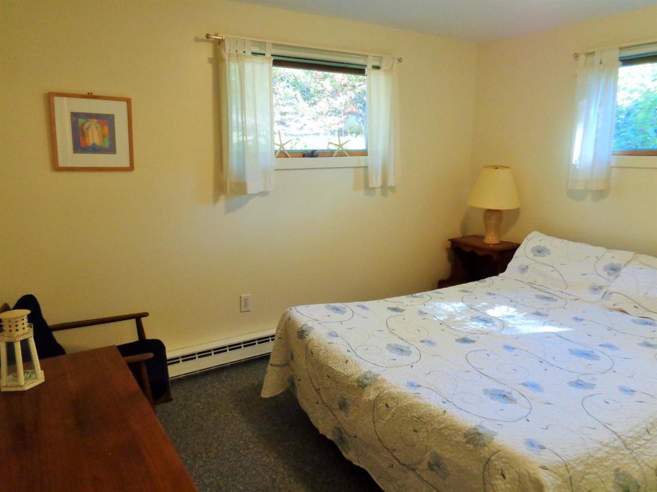 150 Cove View Road Wellfleet, MA 02667 - Photo 26 of 35 a bedroom with a bed and window