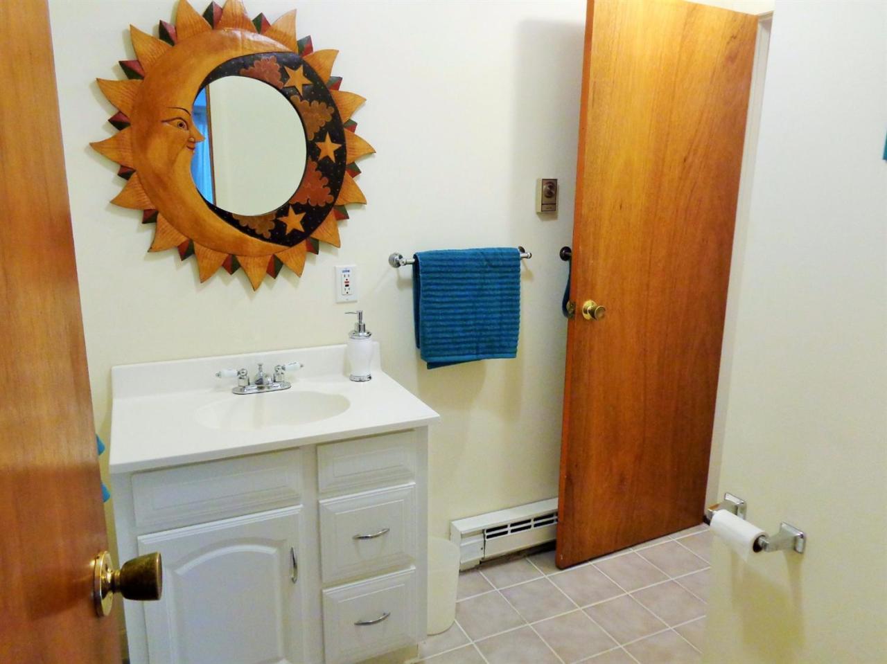 150 Cove View Road Wellfleet, MA 02667 - Photo 29 of 35 a bathroom with a sink and a mirror