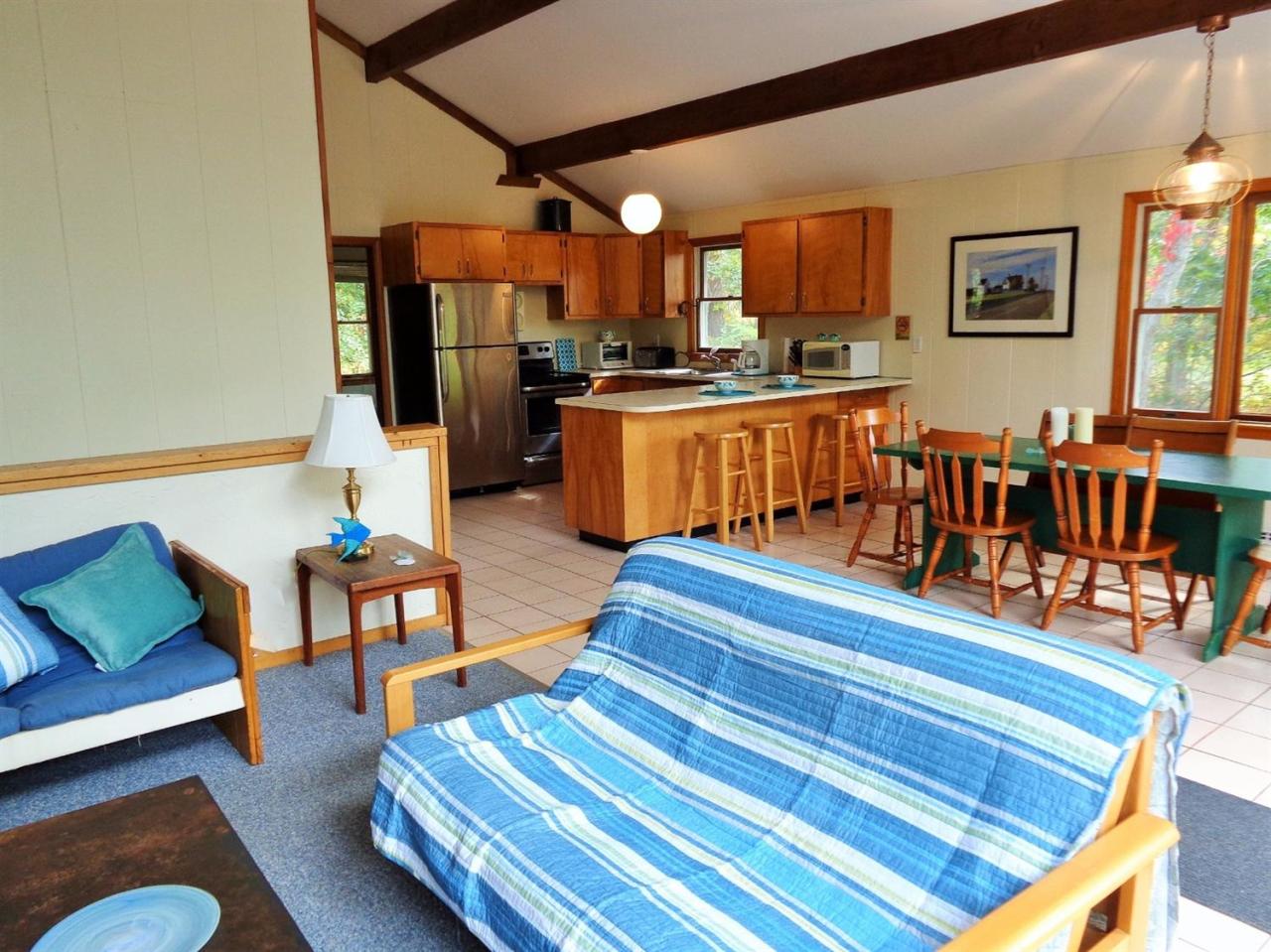 150 Cove View Road Wellfleet, MA 02667 - Photo 8 of 35 a living room with furniture and kitchen view