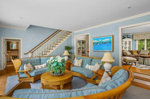 a spacious bedroom with a large bed and a large window