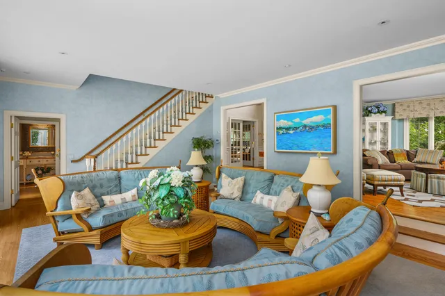 a spacious bedroom with a large bed and a large window