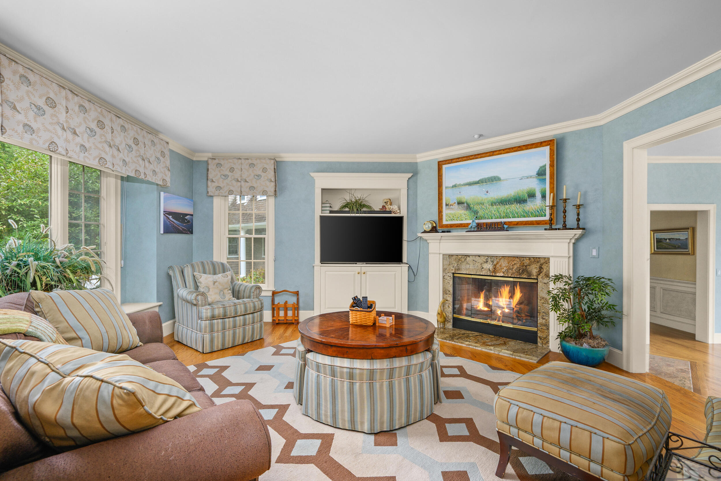 359 Baxter Neck Road Marstons Mills, MA 02648 - Photo 21 of 100 a living room with furniture a flat screen tv and a fireplace