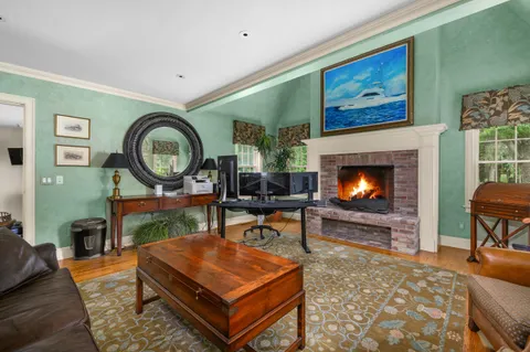 a view of a porch with furniture and floor to ceiling window