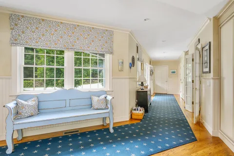 a bedroom with a large bed and a large window