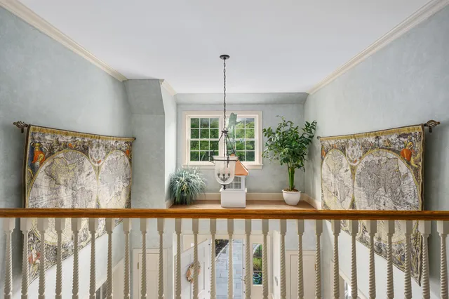 a kitchen with stainless steel appliances kitchen island granite countertop a table chairs and a refrigerator