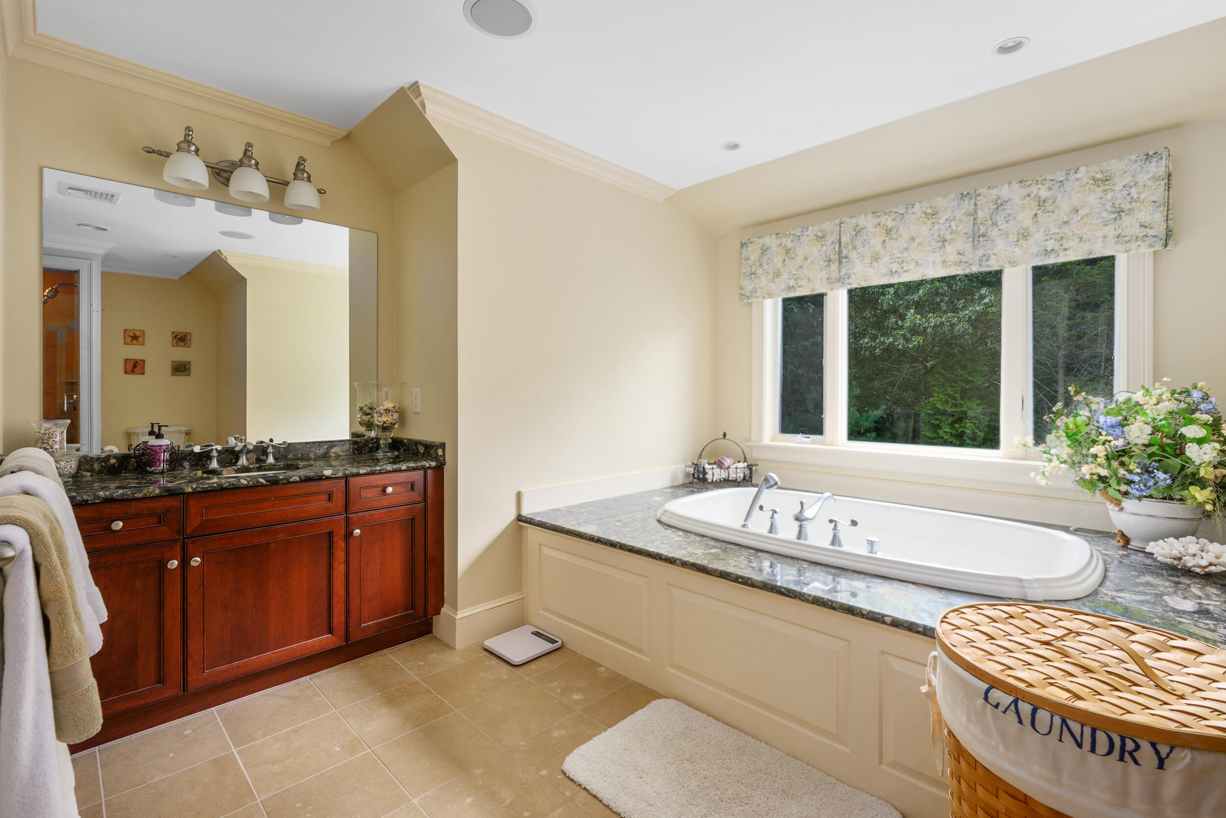 359 Baxter Neck Road Marstons Mills, MA 02648 - Photo 42 of 100 a spacious bathroom with a granite countertop tub sink and mirror