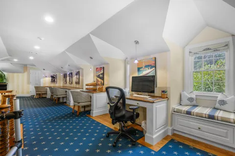 a front view of a house with porch and glass windows