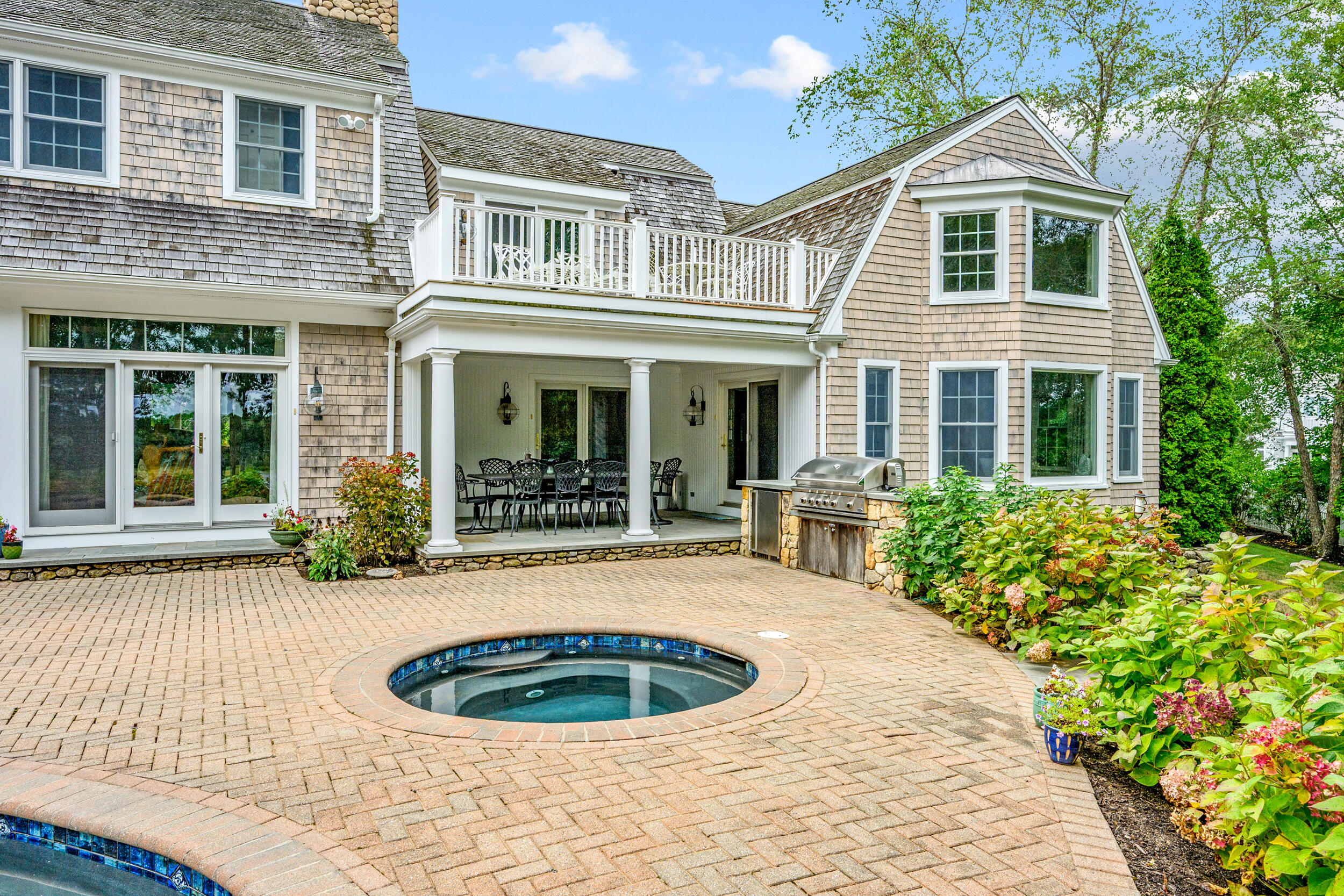 359 Baxter Neck Road Marstons Mills, MA 02648 - Photo 76 of 100 a front view of a house with porch and glass windows