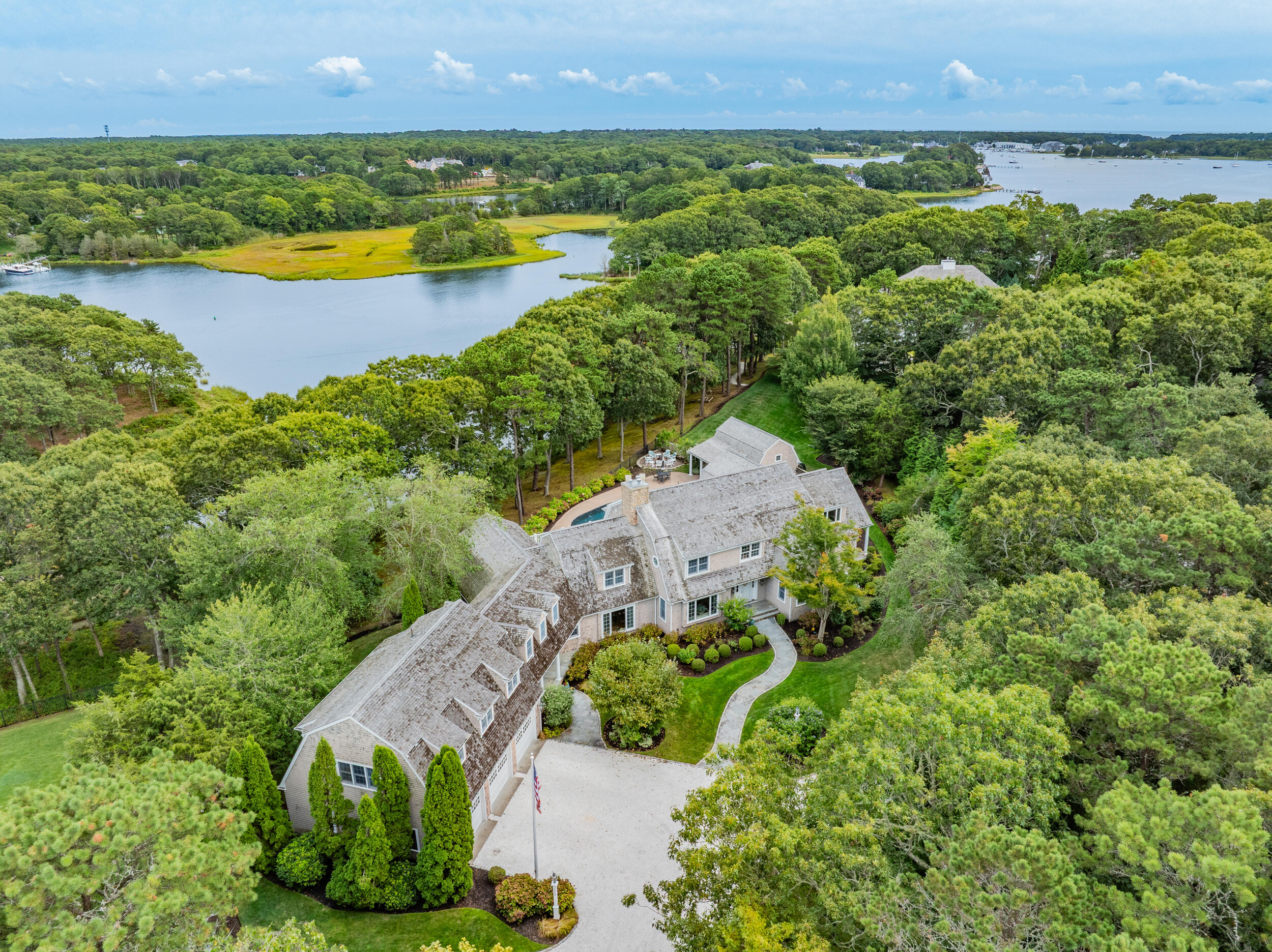 359 Baxter Neck Road Marstons Mills, MA 02648 - Photo 87 of 100 an aerial view of a house with a garden and lake view