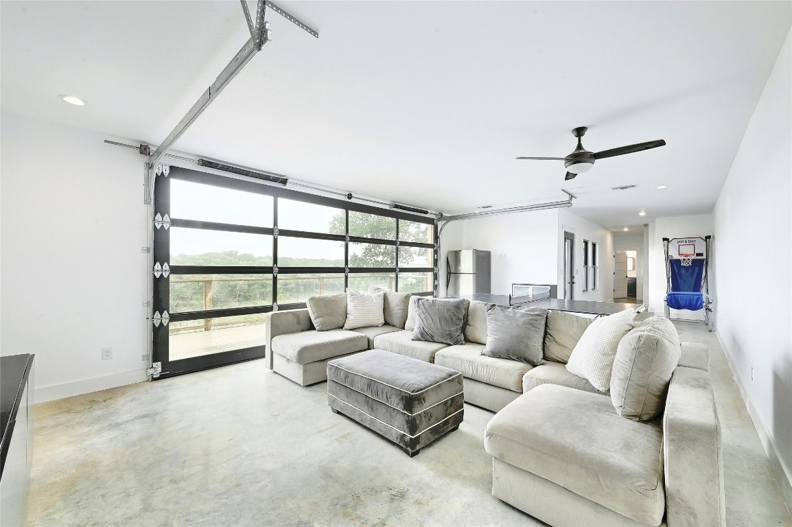 26701 Blue Cove Road Marble Falls, TX 78654 - Photo 14 of 27 a living room with furniture and a large window
