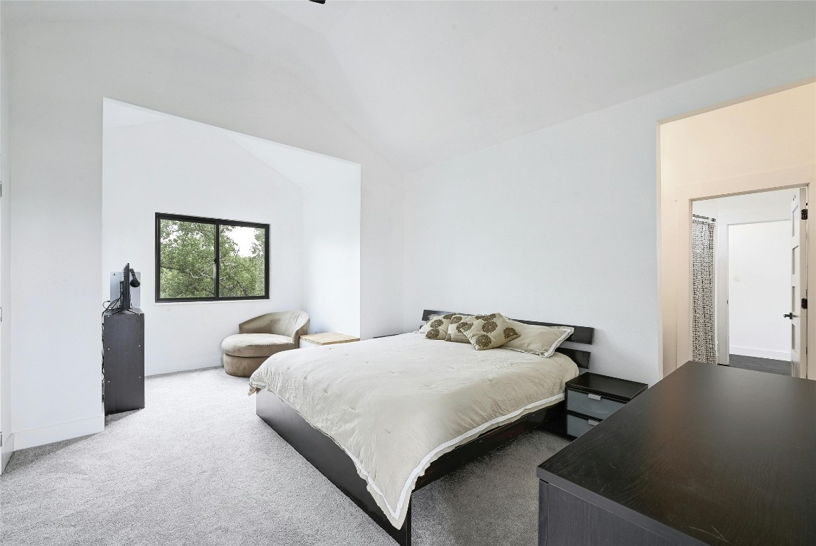 26701 Blue Cove Road Marble Falls, TX 78654 - Photo 17 of 27 a bedroom with a bed and a window